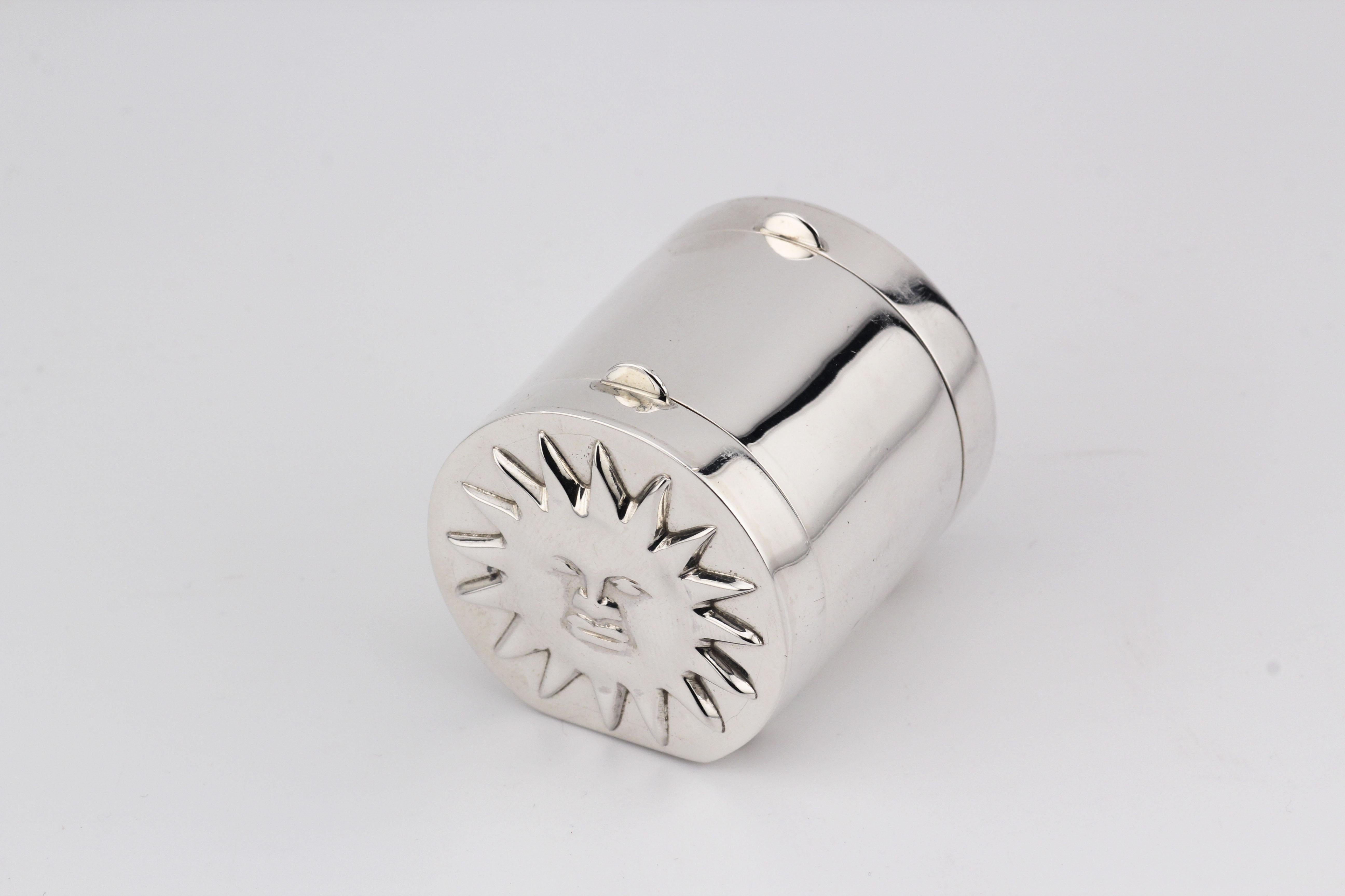 Introducing the Tiffany & Co. Sun Moon Sterling Silver 2-Sided Cylinder Pillbox – a celestial-inspired masterpiece that seamlessly marries function with poetic design. Crafted by the esteemed Tiffany & Co., this exquisite pillbox captures the