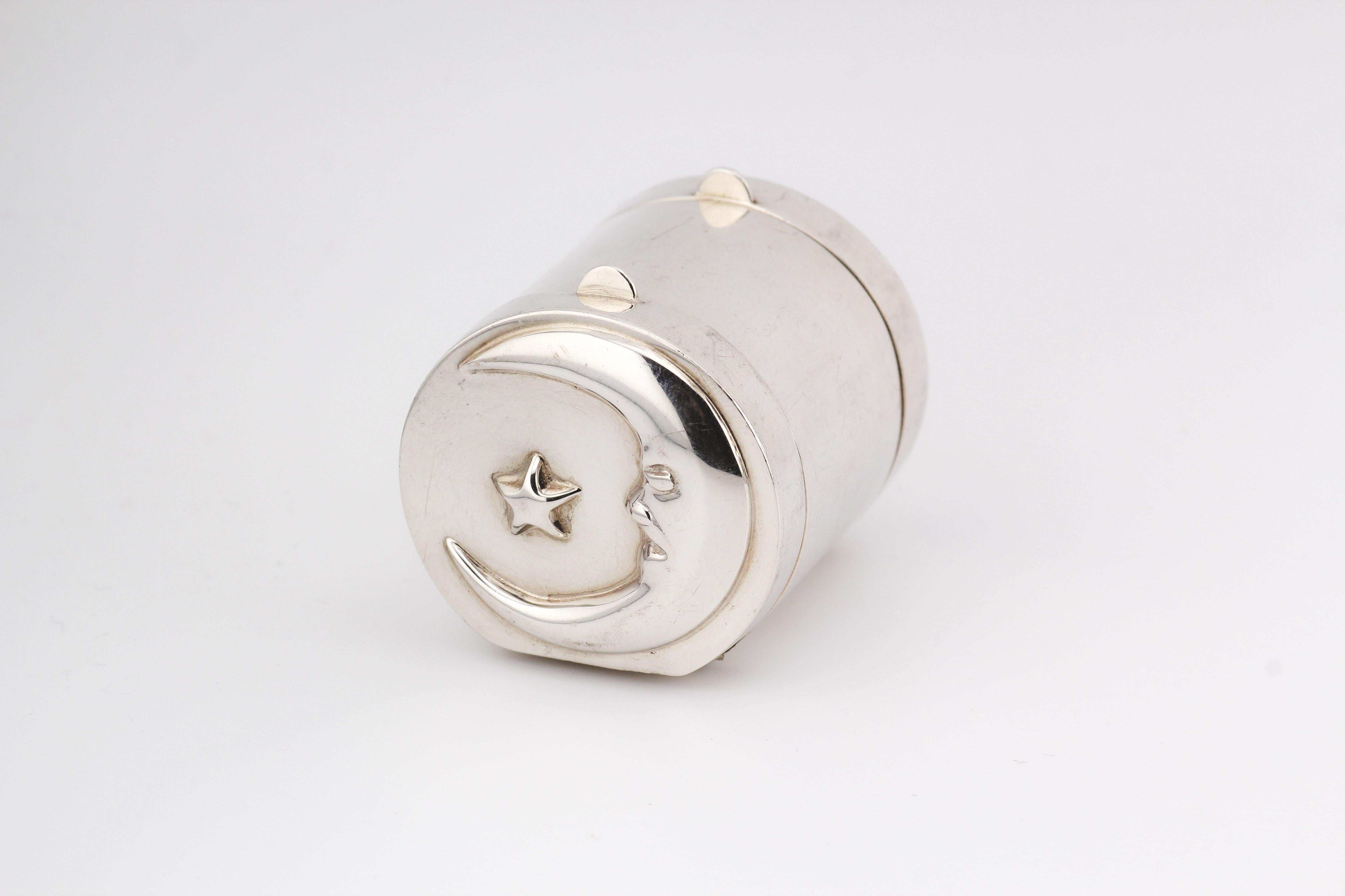 Introducing the Tiffany & Co. Sun Moon Sterling Silver 2-Sided Cylinder Pillbox – a celestial-inspired masterpiece that seamlessly marries function with poetic design. Crafted by the esteemed Tiffany & Co., this exquisite pillbox captures the