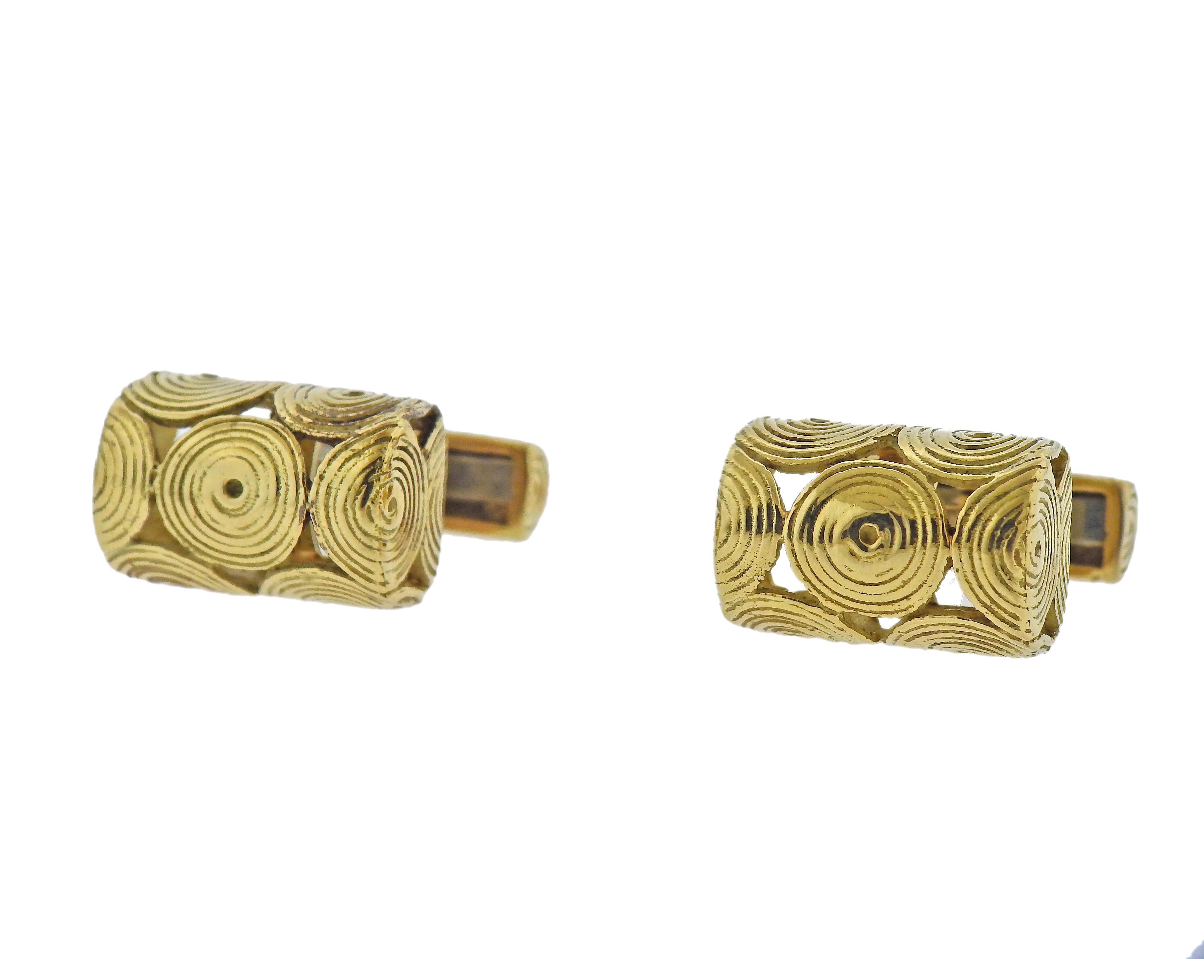 Pair of 18k gold swirl motif cufflinks by Tiffany & Co. Top measures 19mm x 13mm. Marked: Tiffany, 18k. Weight - 24.6 grams. 