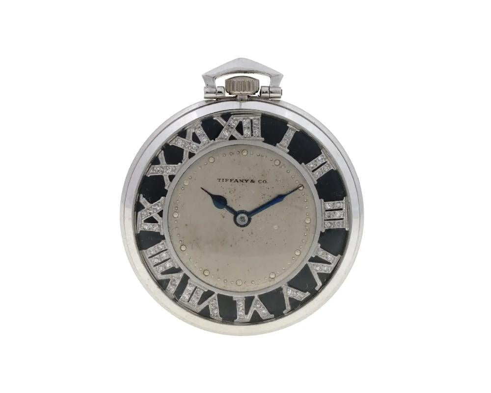 An American Tiffany and Co Platinum pocket watch. Swiss made. An enameled dial with Roman numerals. the numerals are encrusted with Diamonds. Marked with a brand logo on the dial. marked with a Tiffany and Co New York mark, Adjusted, a Swiss mark,