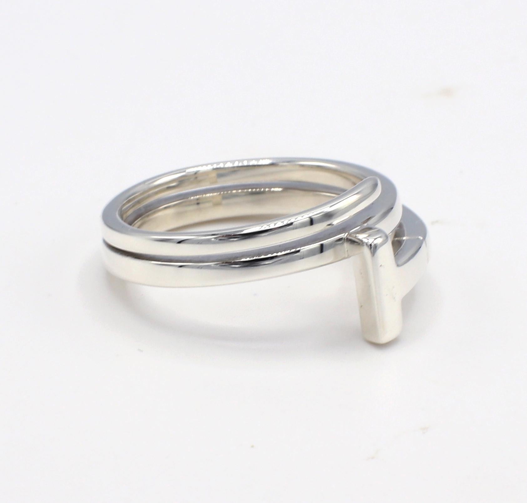 Tiffany & Co. T Collection Sterling Silver Wrap Coin Ring 
Metal: Sterling silver 925
Weight: 5.34 grams
Size: 7.5 (US)
Signed: T&Co Ag925 Italy 
