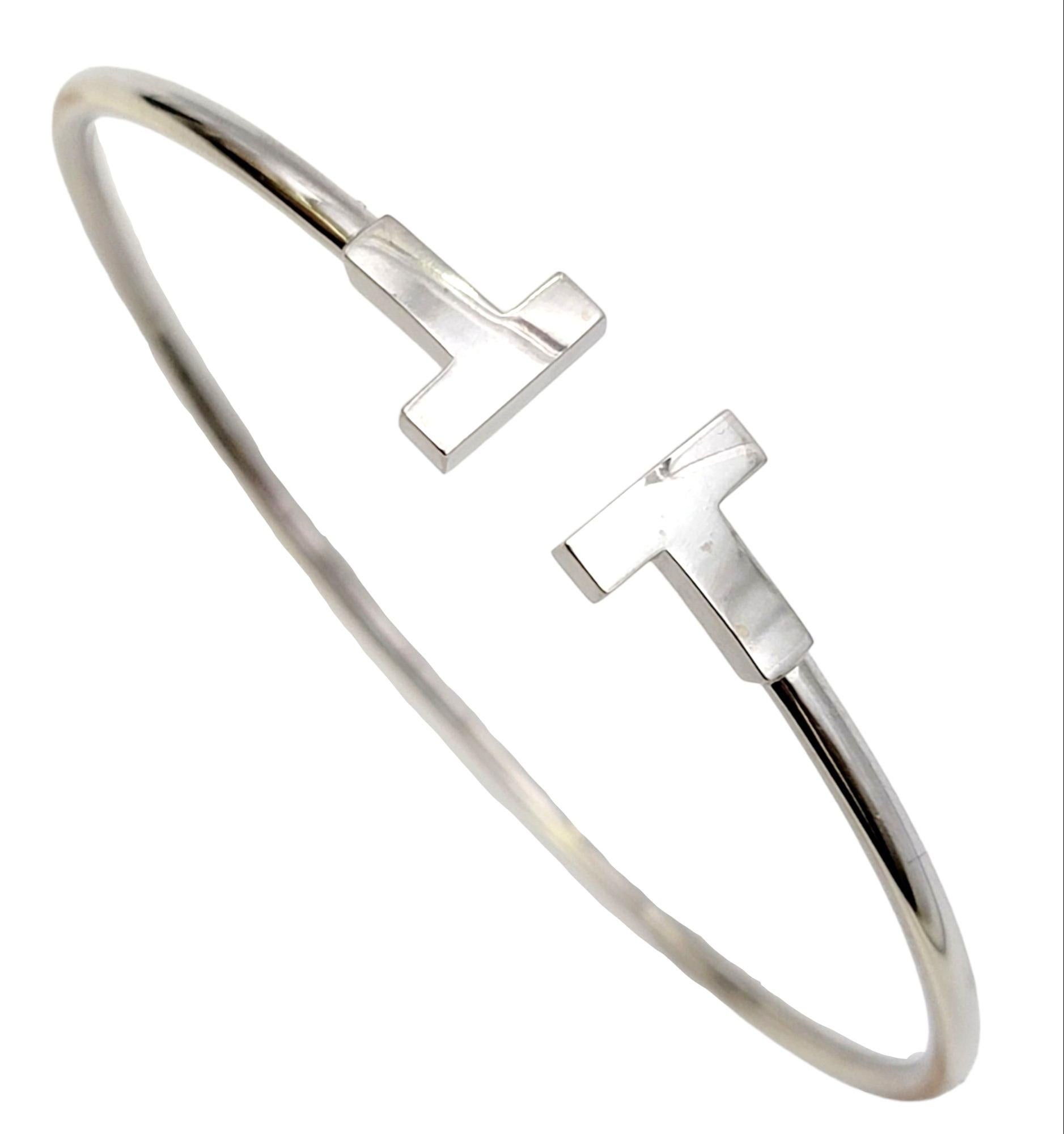 Contemporary elegance is at its finest with this sleek and stunning Tiffany & Co. wire bracelet. Founded in 1837 in New York City, Tiffany & Co. is one of the world's most storied luxury design houses recognized globally for its innovative jewelry