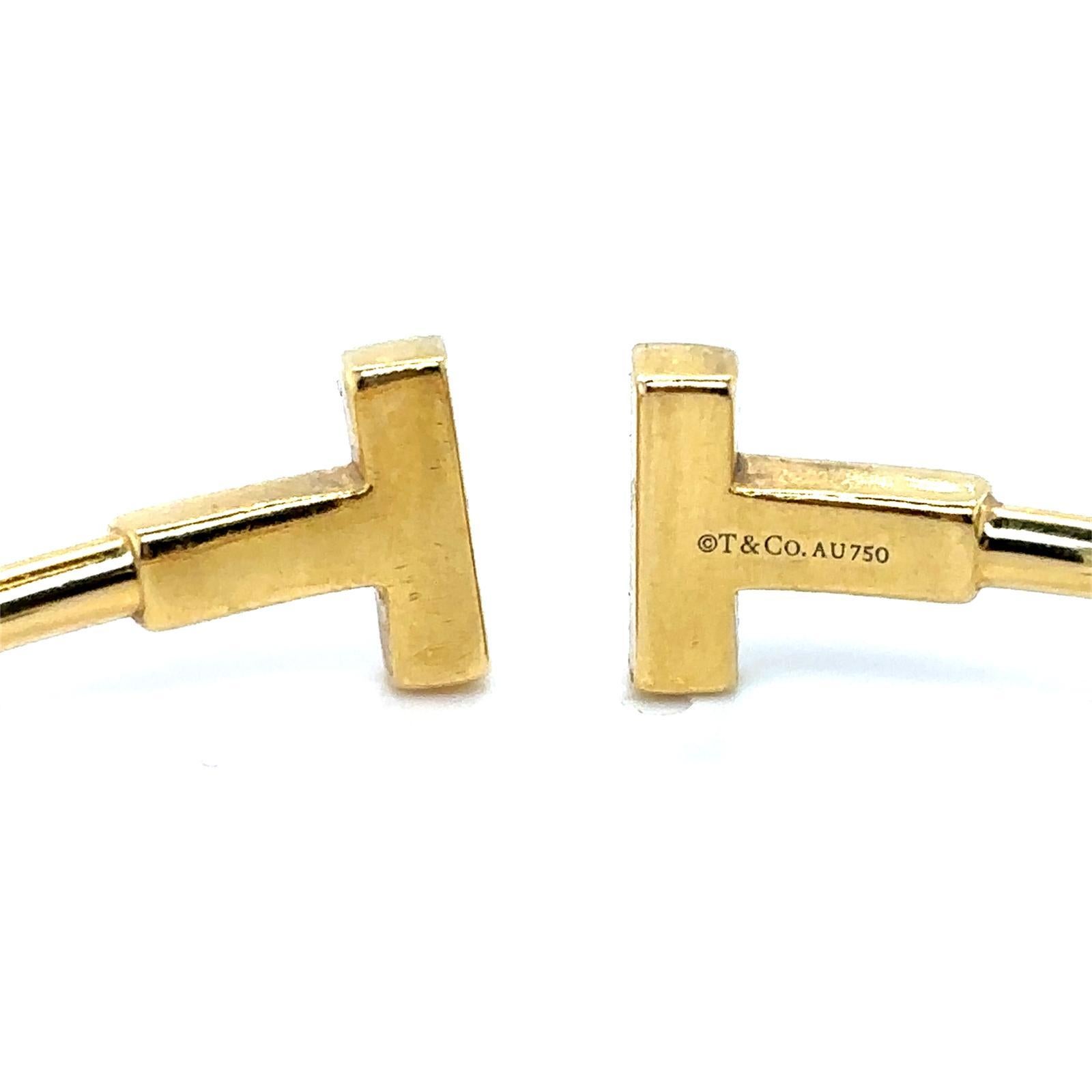 da uomo o donna Tiffany & Co. Bracciale a filo con diamanti T in oro giallo 18 carati in vendita