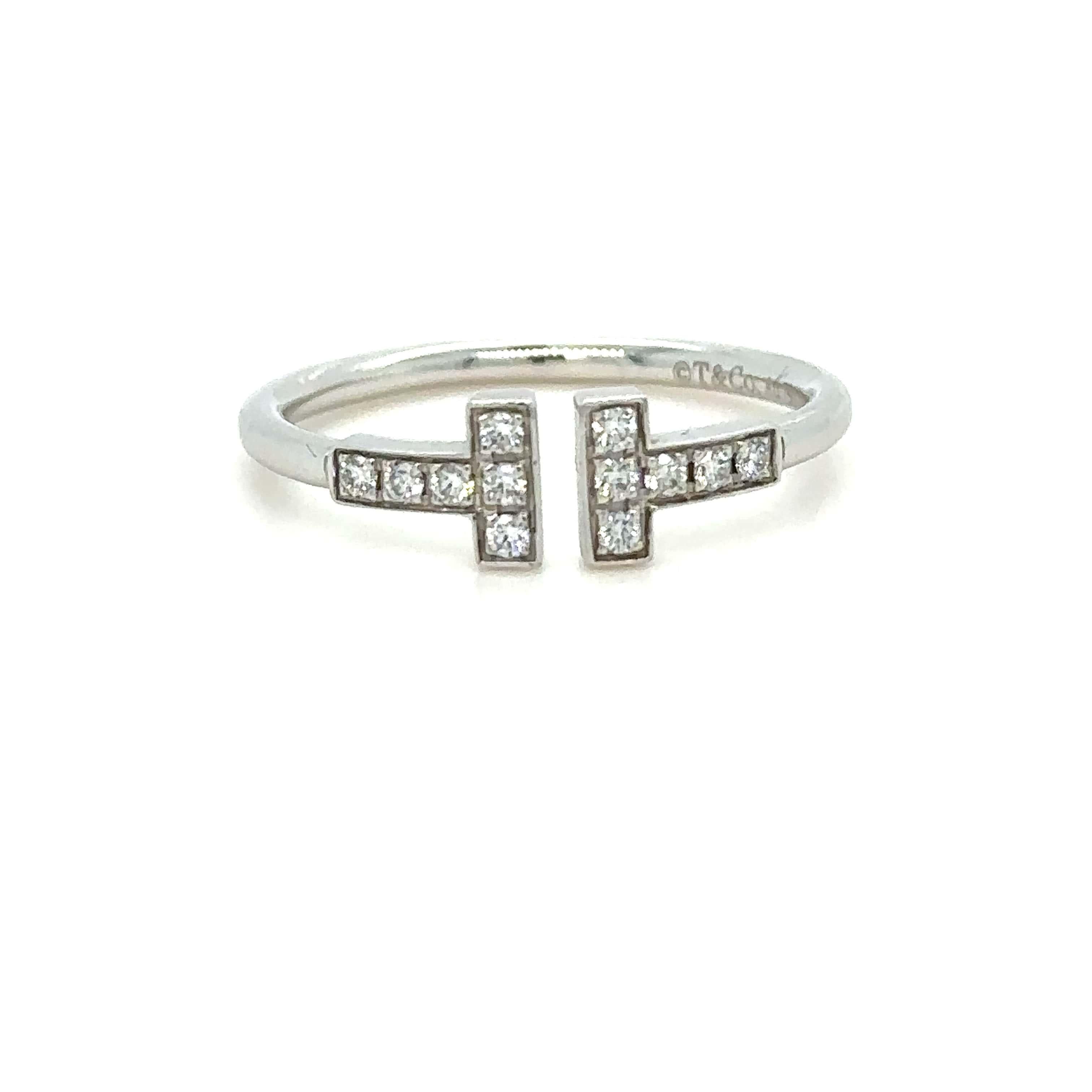 Unique features: 

Tiffany T Diamond Wire Ring in 18k White Gold with round brilliant diamonds.

Metal: 18ct White Gold
Carat: 0.13ct
Colour: N/A
Clarity:  N/A
Cut: Round Brilliant
Weight: N/A
Engravings/Markings: Au750 Italy

Size/Measurement: Ring