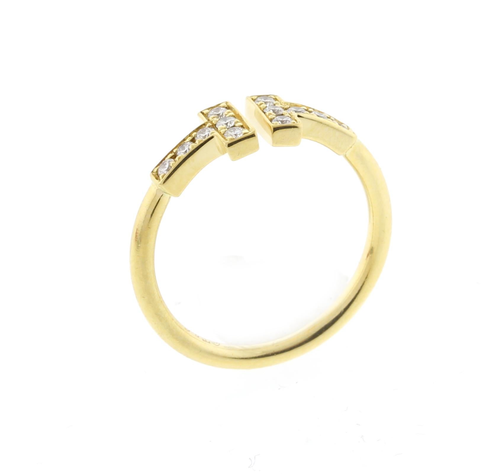 From Tiffany & Co.'s  iconic, the Tiffany T collection this diamond wire T ring, accented with scintillating diamonds, accentuating this ring's bold and timeless form.
♦ Designer: Tiffany & Co.
♦ Metal: 18 karat
♦ Circa 2010
♦ 1.5mm wide band
♦ 12.