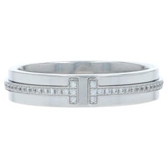 Tiffany 
Co. Fascia stretta con diamanti a T - Anello in oro bianco 18 carati con diamante rotondo da 13 ct.