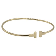 Tiffany & Co. T. Narrow Wire 18 Karat Yellow Gold Bangle Bracelet