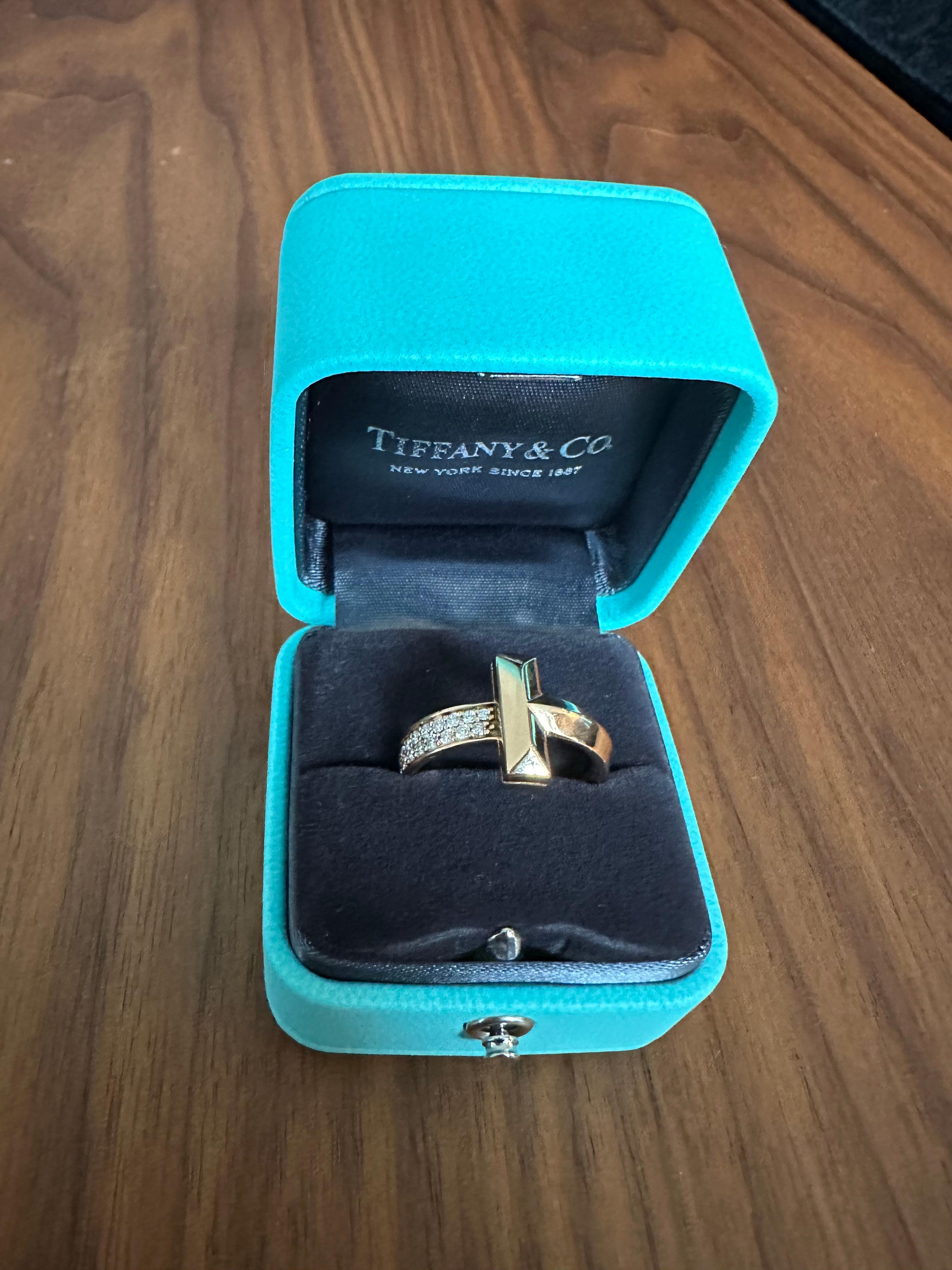 Tiffany CO T T1 wide ring with half row brilliant cut diamonds 0.21 ctw
size 6.5
comes within the box
no defects and visible signs of usage 
never been refurbished 
Retail value over $5,000
Great as a gift 
