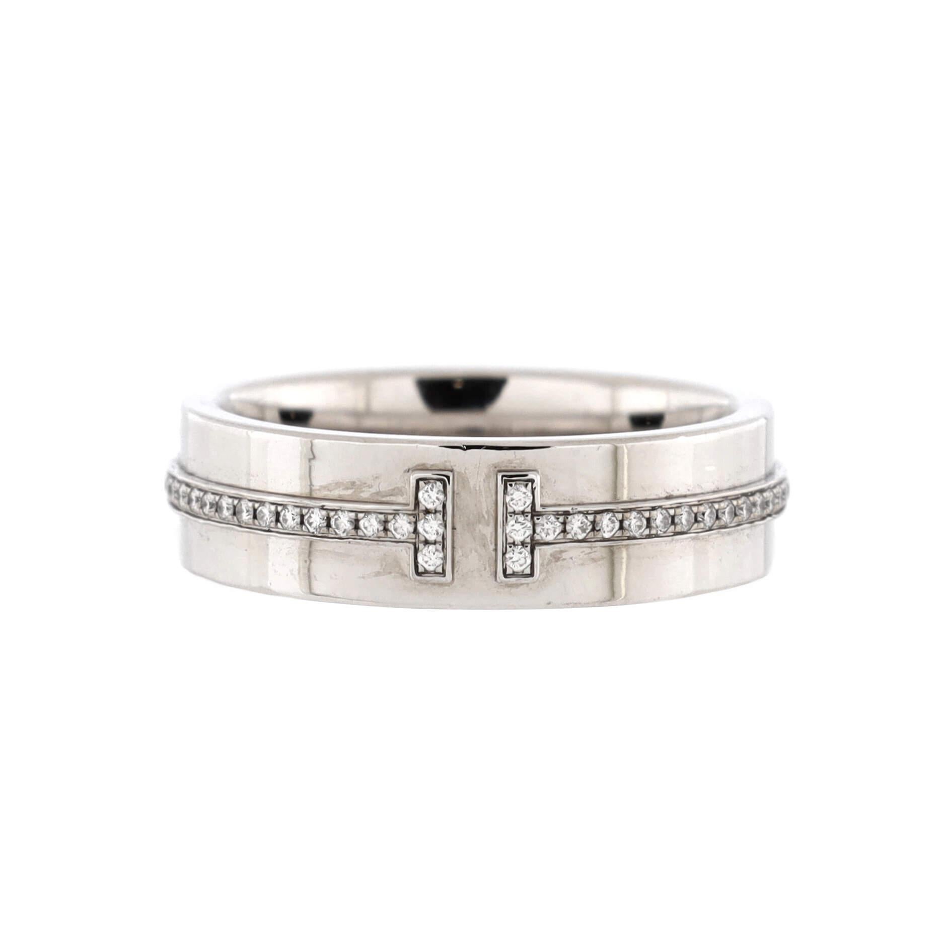 Condition: Great. Minor wear throughout.
Accessories: No Accessories
Measurements: Size: 9, Width: 5.3 mm
Designer: Tiffany & Co.
Model: T Two Ring 18K White Gold and Diamonds Wide
Exterior Color: White Gold
Item Number: 206772/26
