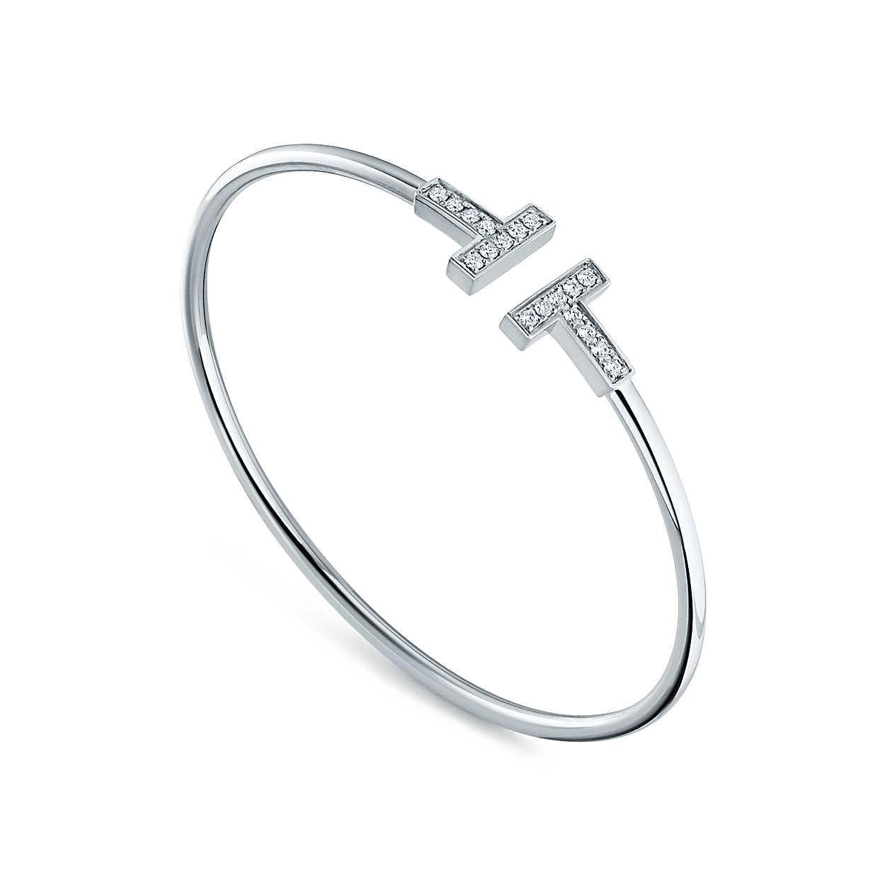 Brilliant diamonds enhance this bracelet's timeless design. As multifaceted as it is iconic, the Tiffany T collection is a tangible reminder of the connections we feel but can't always see. Pair this wire bracelet with other Tiffany T designs for a