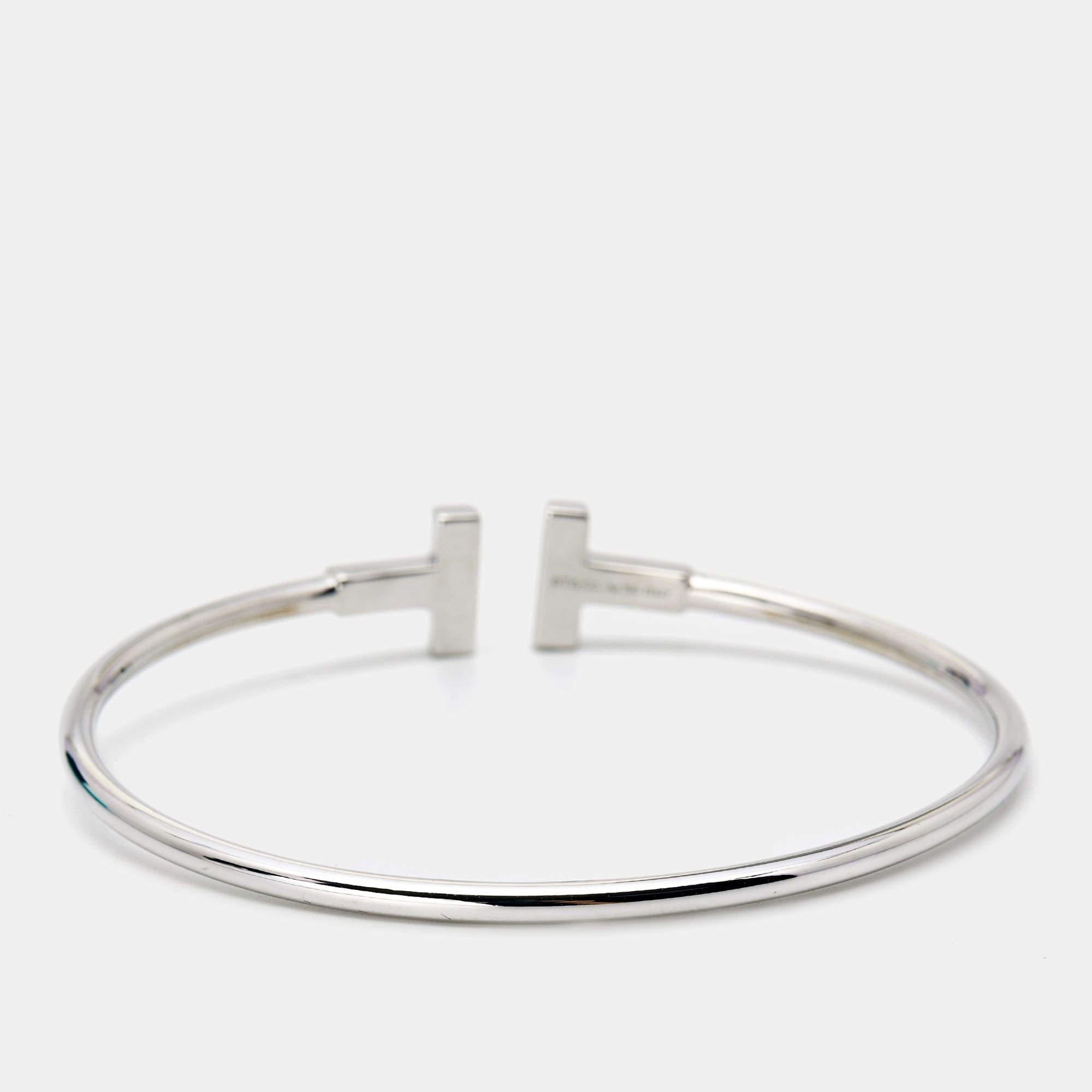 The Tiffany T collection by Tiffany & Co. has been inspired by the city of New York. Each piece comes with a distinct shape that boasts fabulous style and structure. This T Wire bracelet is crafted from 18k white gold and styled as a wire-like band