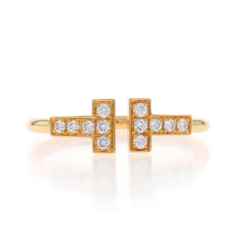 Retail Price: $2,675

Size: 6 1/2

Brand: Tiffany & Co.
Collection: T
Design:  Wire Ring

Metal Content: 18k Yellow Gold

Stone Information
Natural Diamonds
Carat(s): .13ctw
Cut: Round Brilliant
Color: E - F
Clarity: VS1 - VS2

Total Carats: