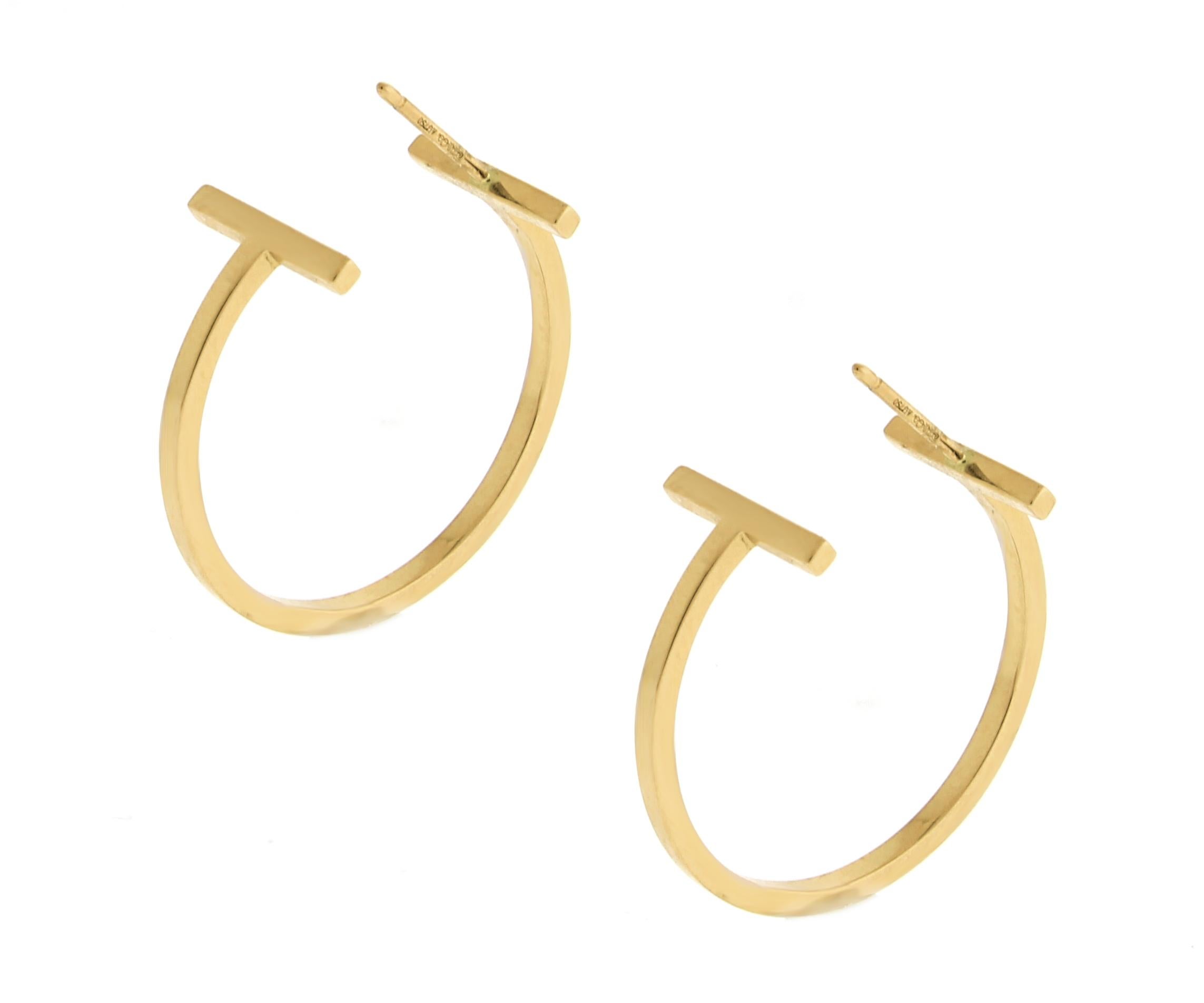 The Tiffany T collection, Graphic angles and clean lines blend to create the beautiful clarity.    Bold and elegant, these hoops are a modern interpretation of a classic design.

18 karat rose gold
Size medium 1 inch diameter