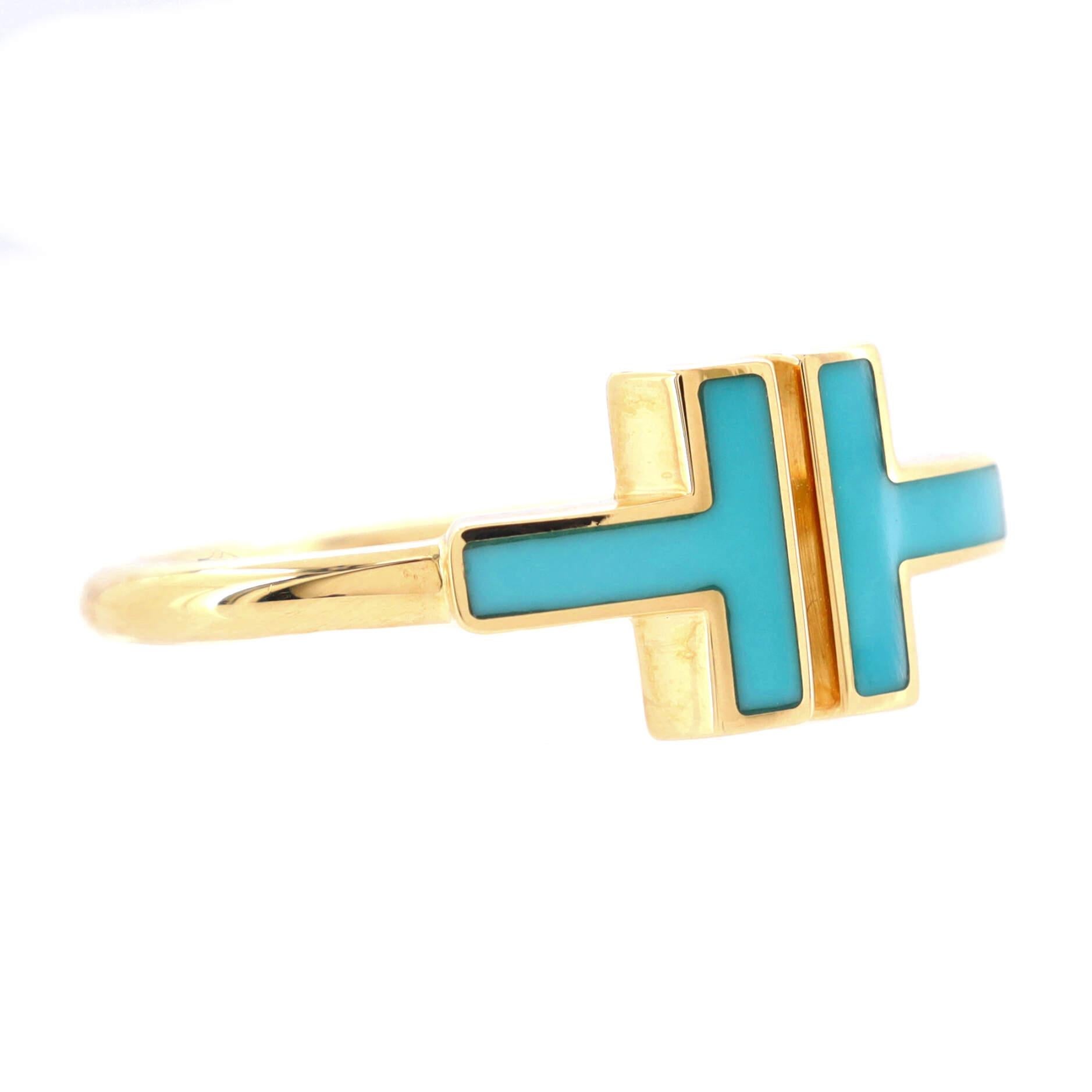 Condition: Very good. Moderate wear throughout.
Accessories: No Accessories
Measurements: Size: 6.75 - 54, Width: 1.95 mm
Designer: Tiffany & Co.
Model: T Wire Ring 18K Yellow Gold with Turquoise
Exterior Color: Yellow Gold
Item Number: 189914/421