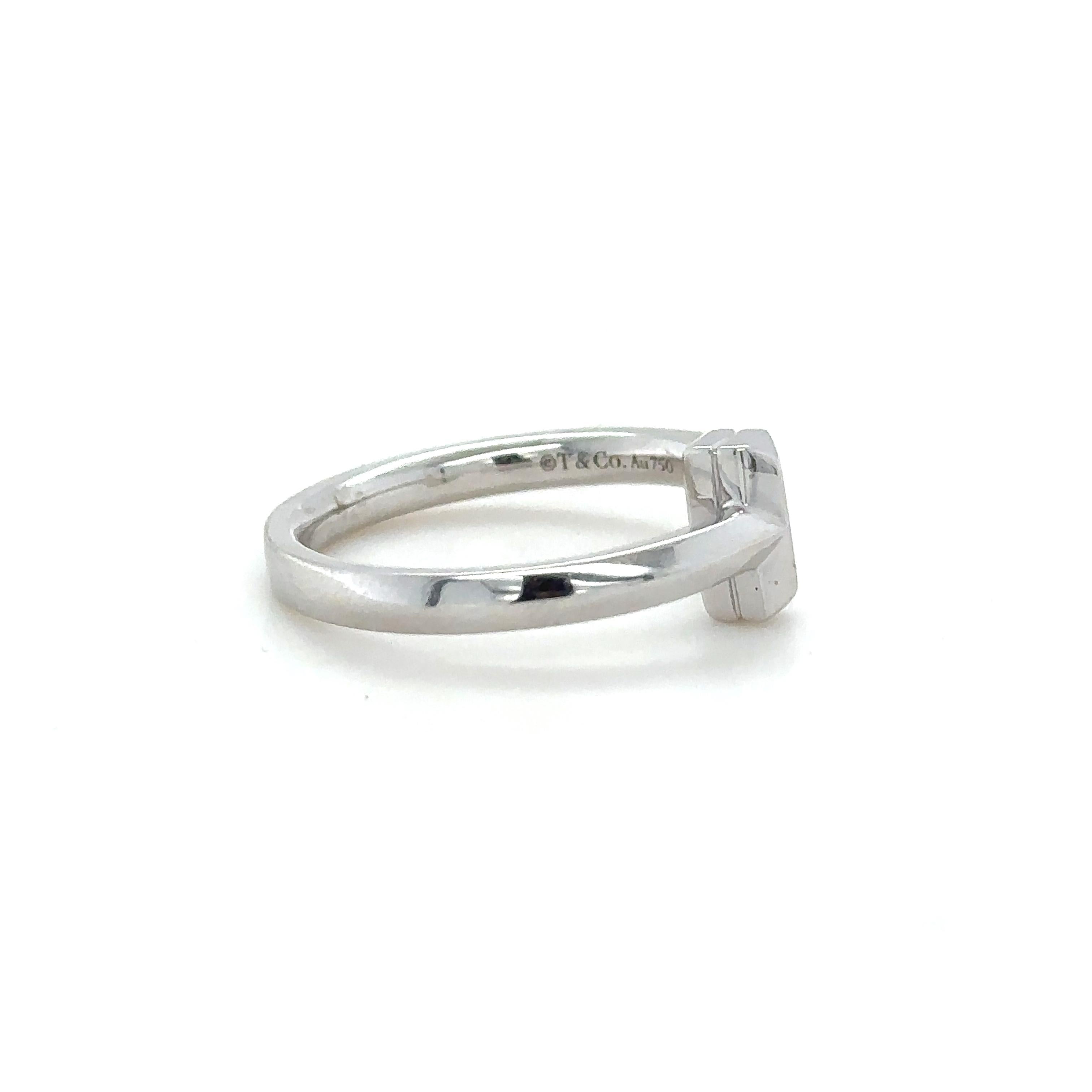 Tiffany & Co 18ct White Gold Tiffany T T1 ring.

Band 2.5mm, Weight 4.77 grams

Metal: 18ct White Gold
Carat: N/A
Colour: N/A
Clarity:  N/A
Cut: N/A
Weight: 4.77 grams
Engravings/Markings: T&Co. Au750

Size/Measurement: Ring Size M / band