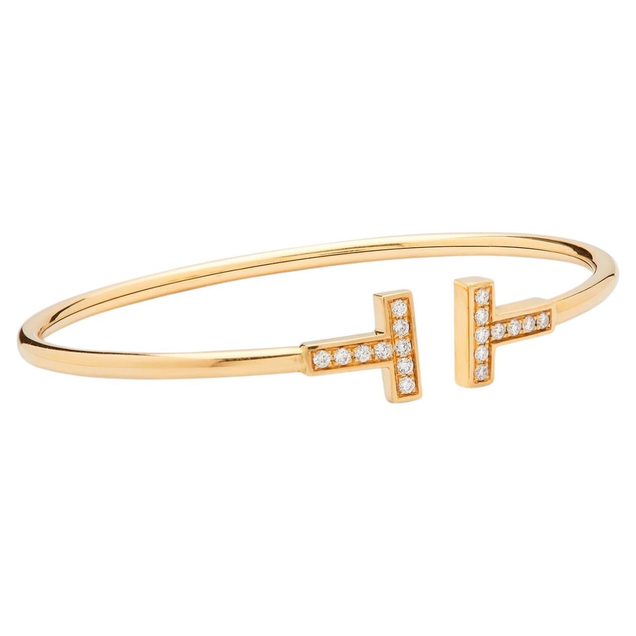 Brazalete de Tiffany & Co. T en oro amarillo y diamantes en venta