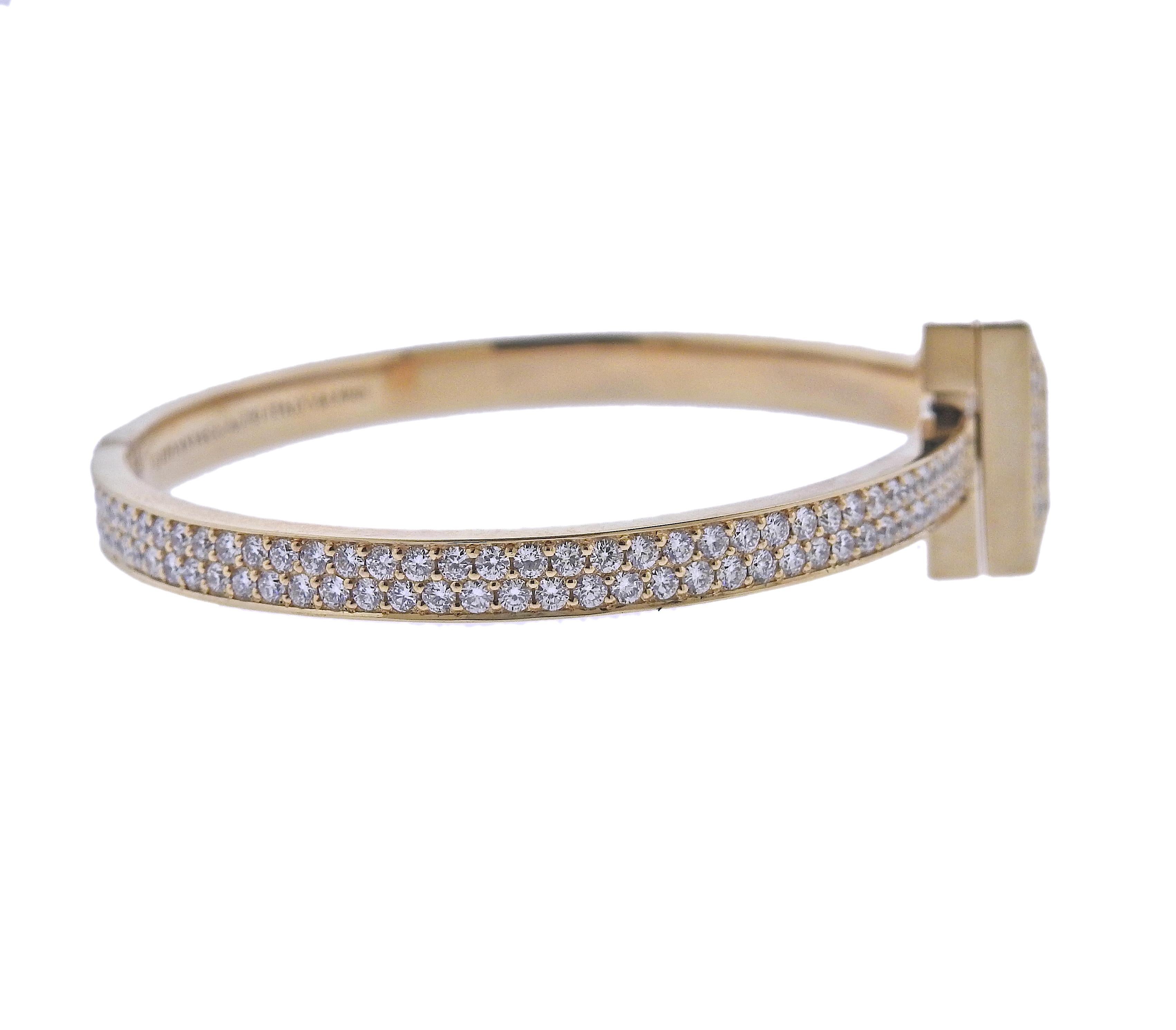 Tiffany & Co 18k yellow gold T1 bracelet, with 4.89ctw in G/VS diamonds. Retail $30,000. Bracelet will fit approx. 7