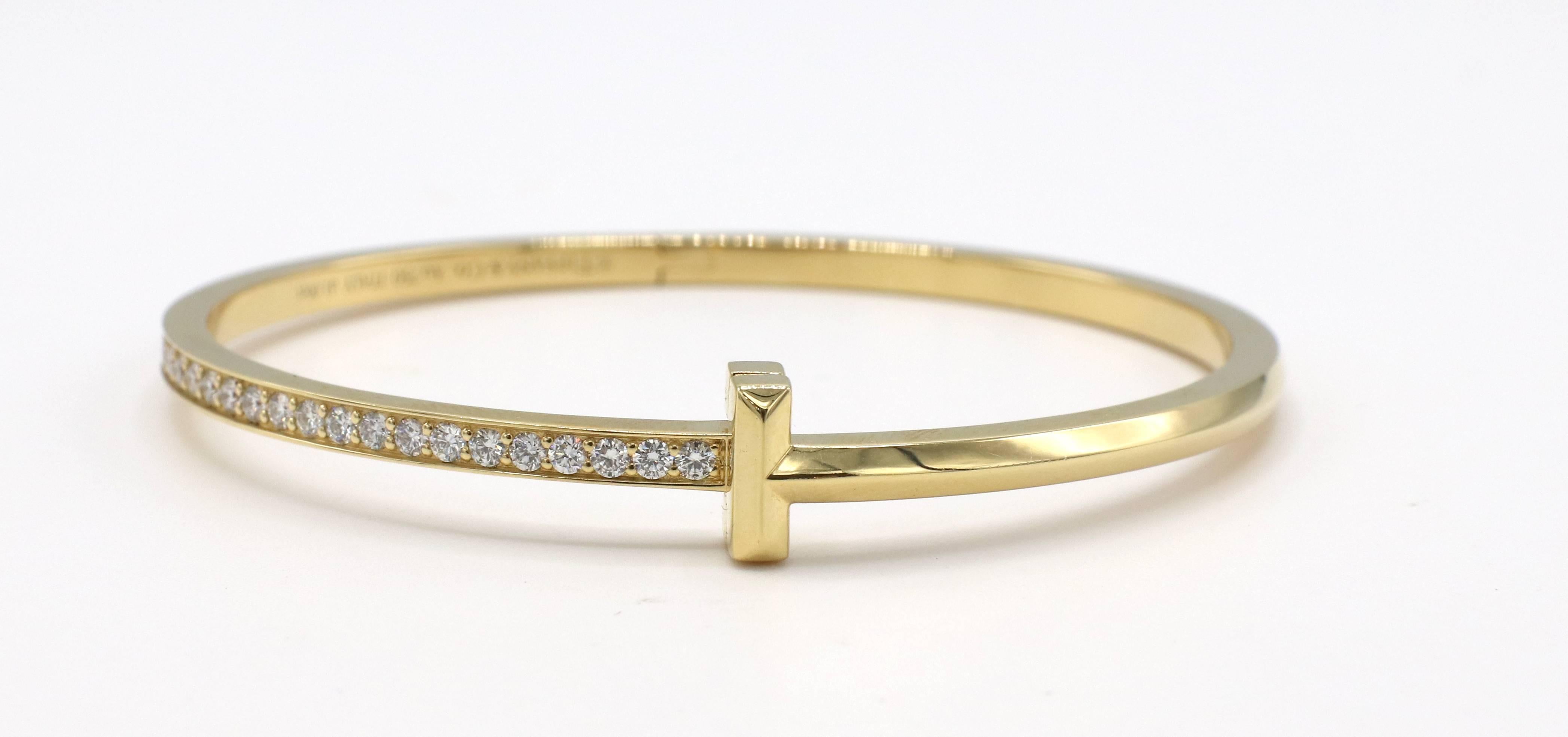 Tiffany & Co. T1 Narrow Diamond Hinged Bangle Bracelet Yellow Gold
Metal: 18k yellow gold
Weight: 21.85 grams
Diamonds: 1 CTW G VS (d 1.00ct hallmark)
Width: 3mm
Signed: 