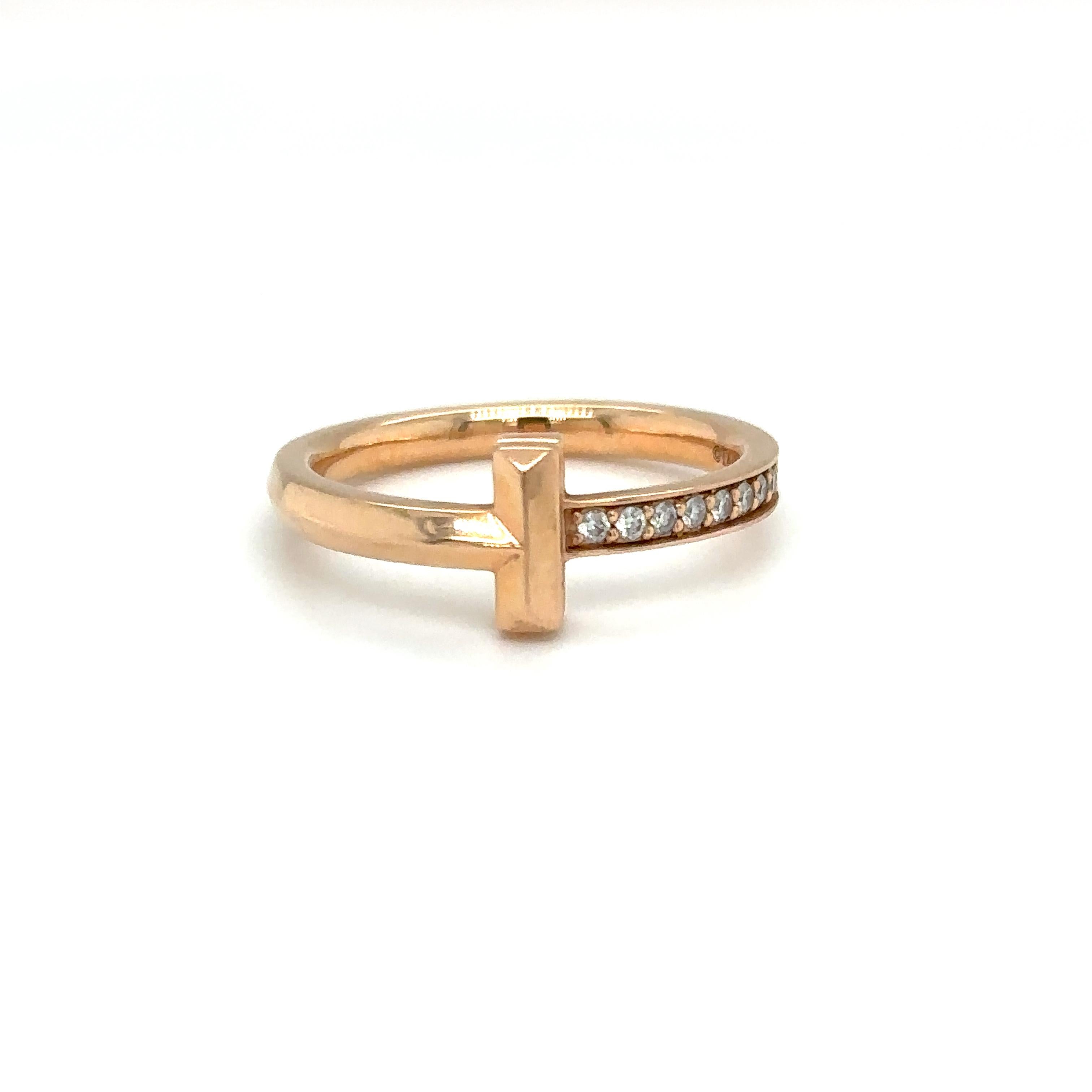 Item Details: This ring from Tiffany & Co's T1 line. Crafted in 18 Karat Rose Gold, it is beautiful and dainty featuring accent diamonds. 

Circa: 2000s
Metal Type: 18 Karat Rose Gold 
Weight: 4.3 Grams
Size: US 7, Resizable

Diamond