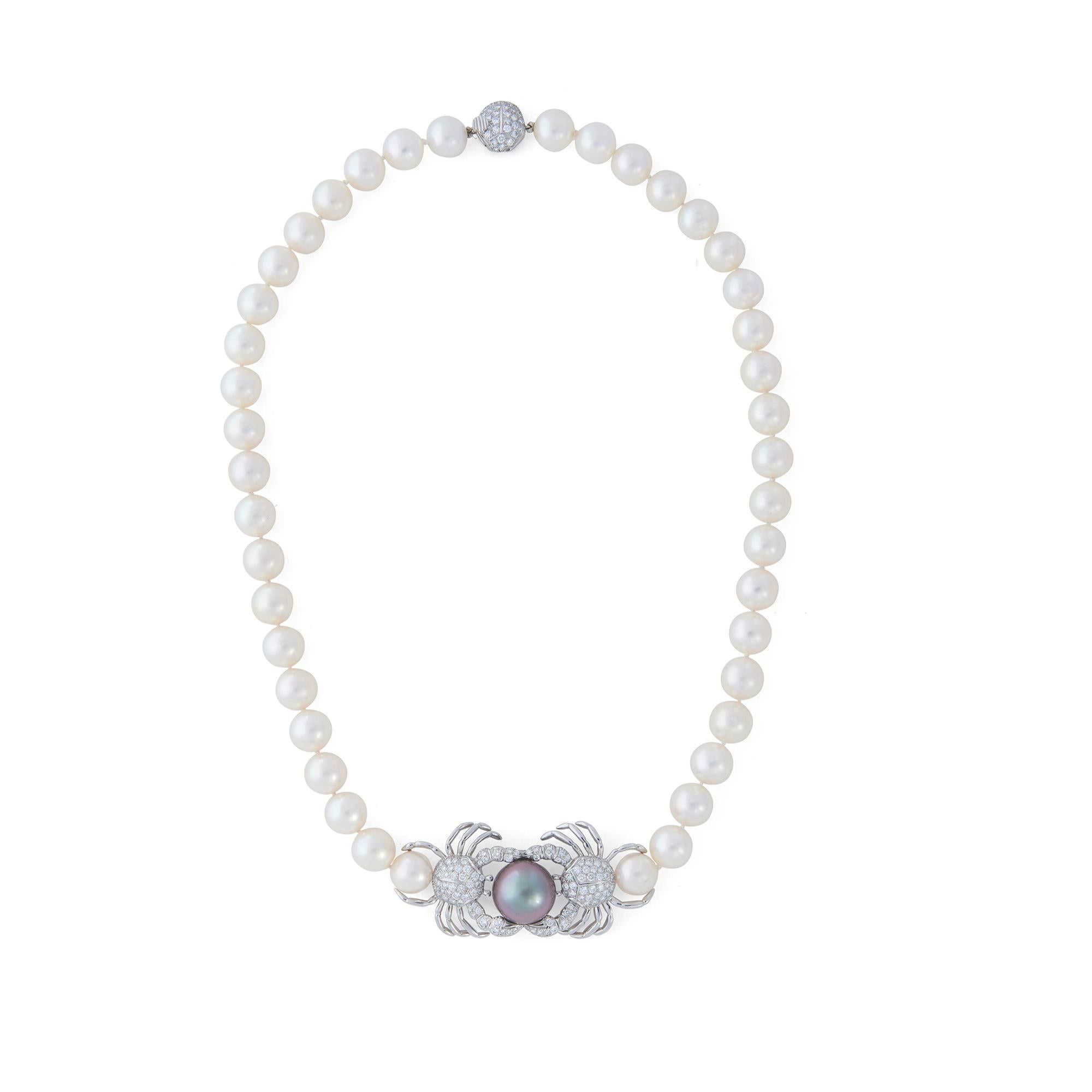 Authentic Tiffany & Co. necklace designed as a strand of round white cultured pearls and featuring a pair of platinum crabs pave-set with high-quality round brilliant cut diamonds weighing an estimated 2.00 carats. A Tahitian pearl measuring