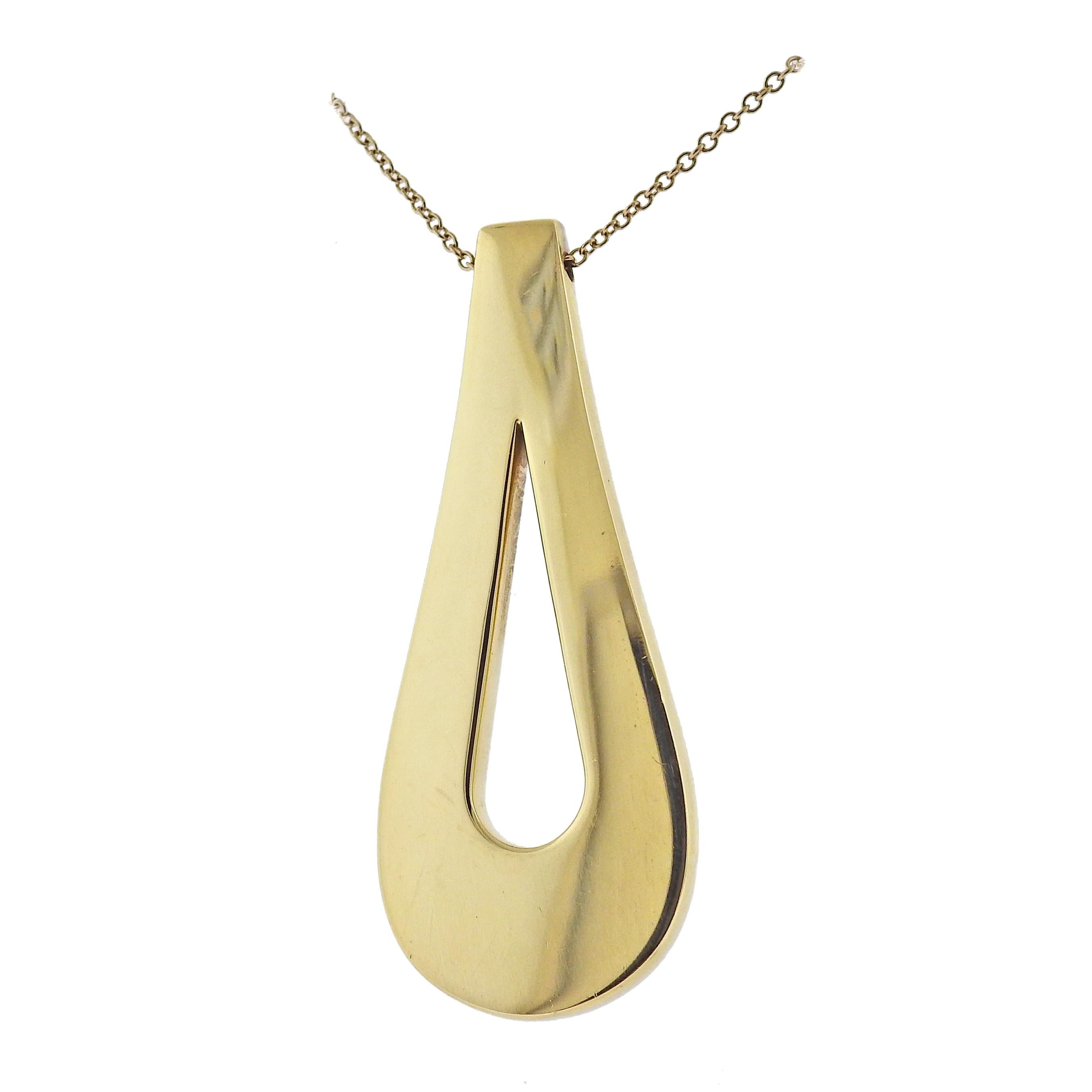 18k yellow gold teardrop pendant on a long chain necklace, by Tiffany & Co. Necklace is 30