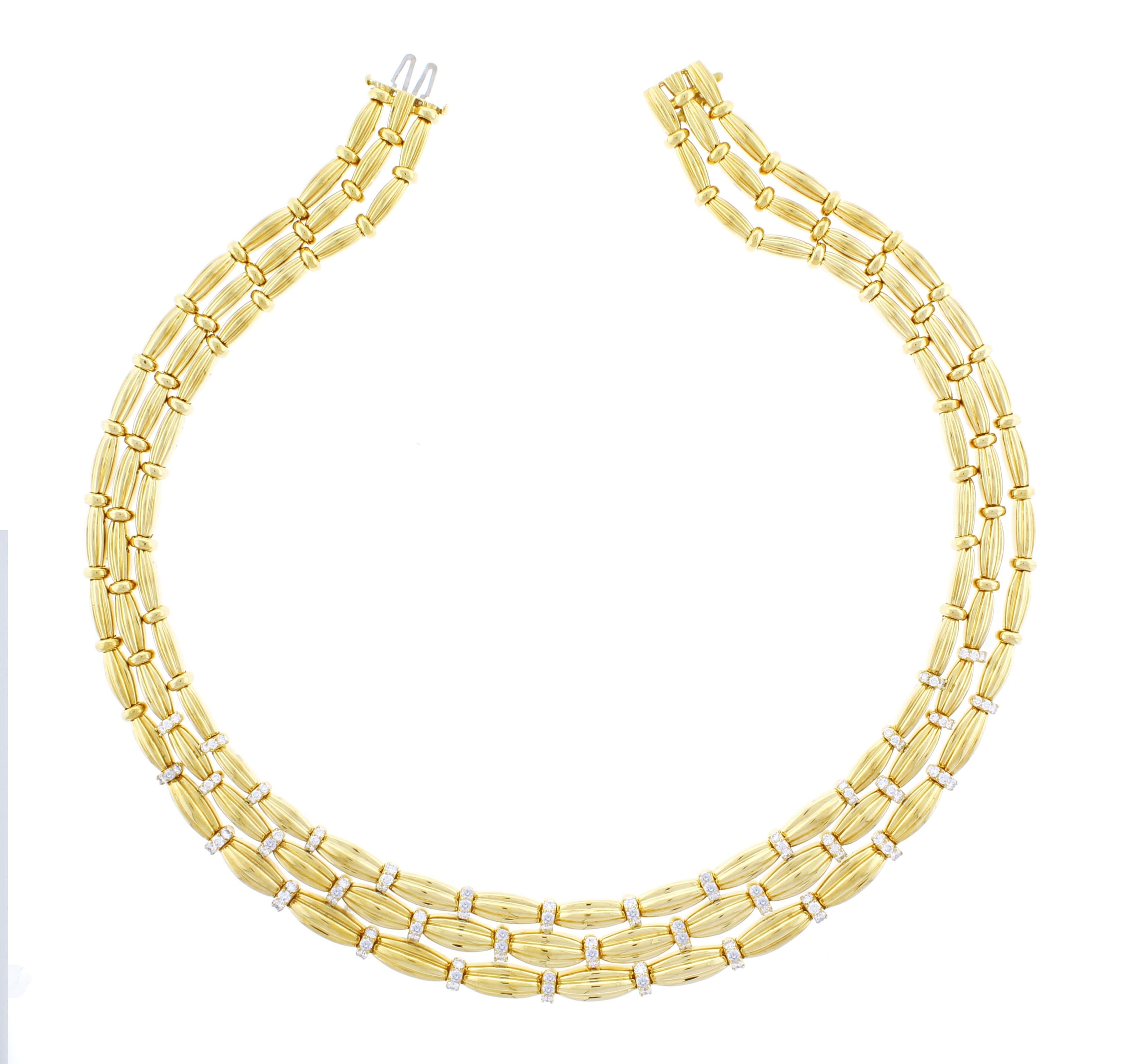 From Tiffany & Co. A three strand gold necklace with diamonds. The necklace is specially designed to fallow the contour of the neck, offering a perfect fit
♦ Designer: Tiffany
♦ Metal: 18 karat
♦ 90 Diamonds= 4.50 carats F-G VVS
♦ Circa 1992
♦  139