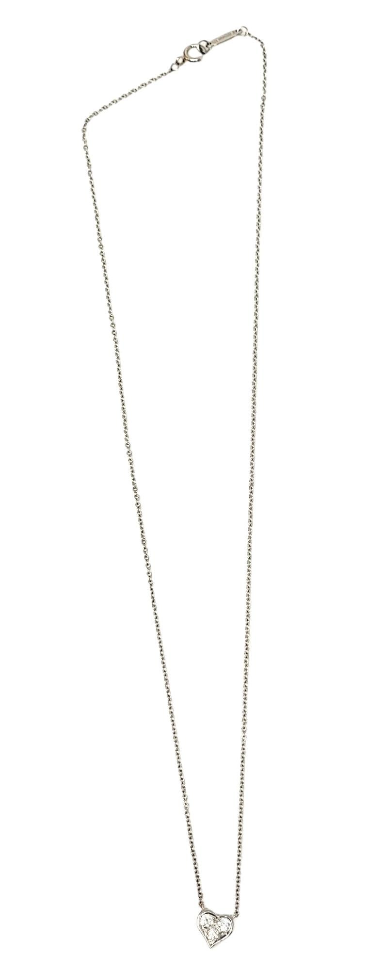 Contemporary Tiffany & Co. Three Stone Diamond Heart Pendant Necklace in Platinum