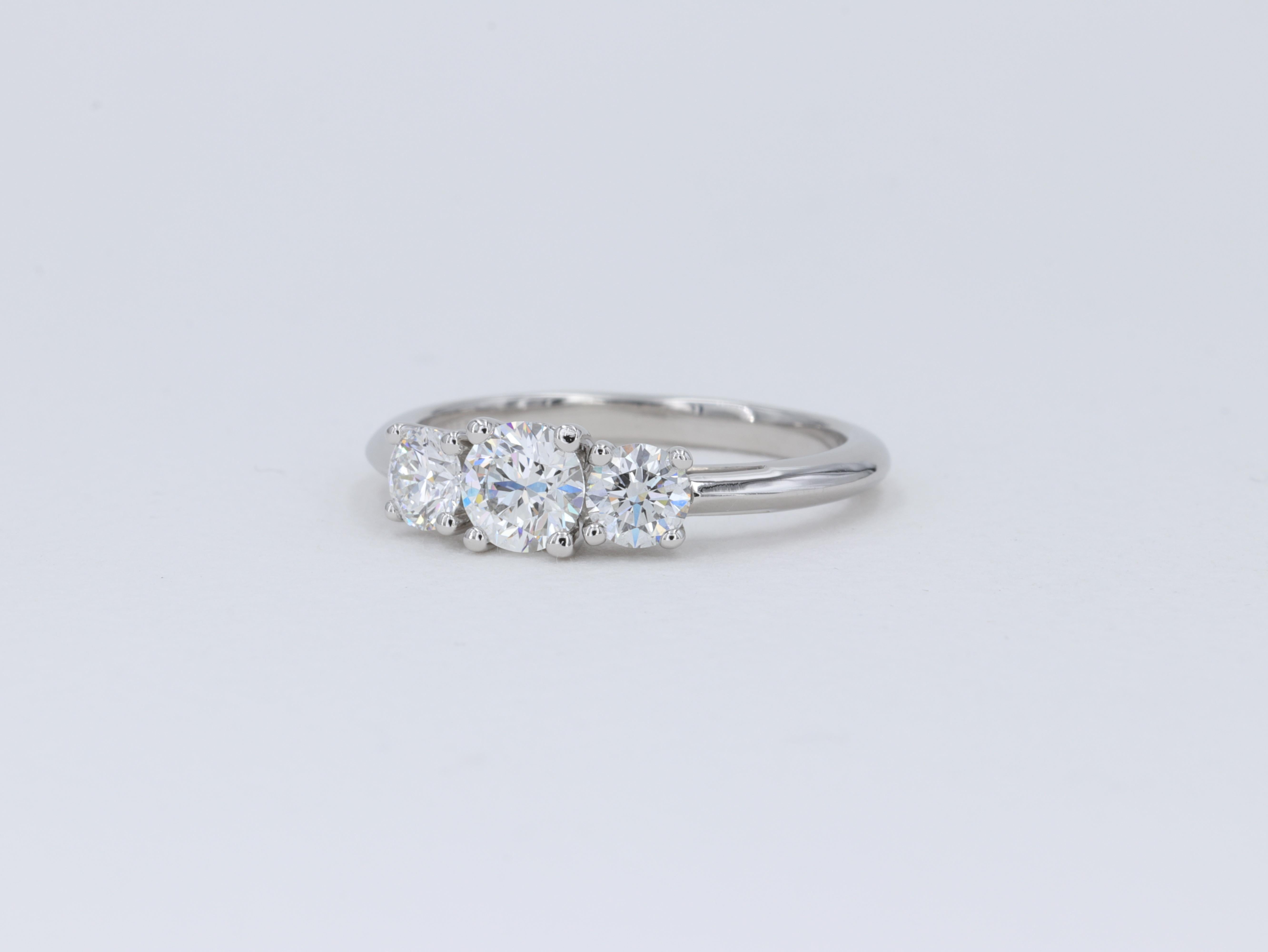 Tiffany & Co. Three Stone Round Brilliant Cut Diamond Platinum Engagement Ring For Sale 2