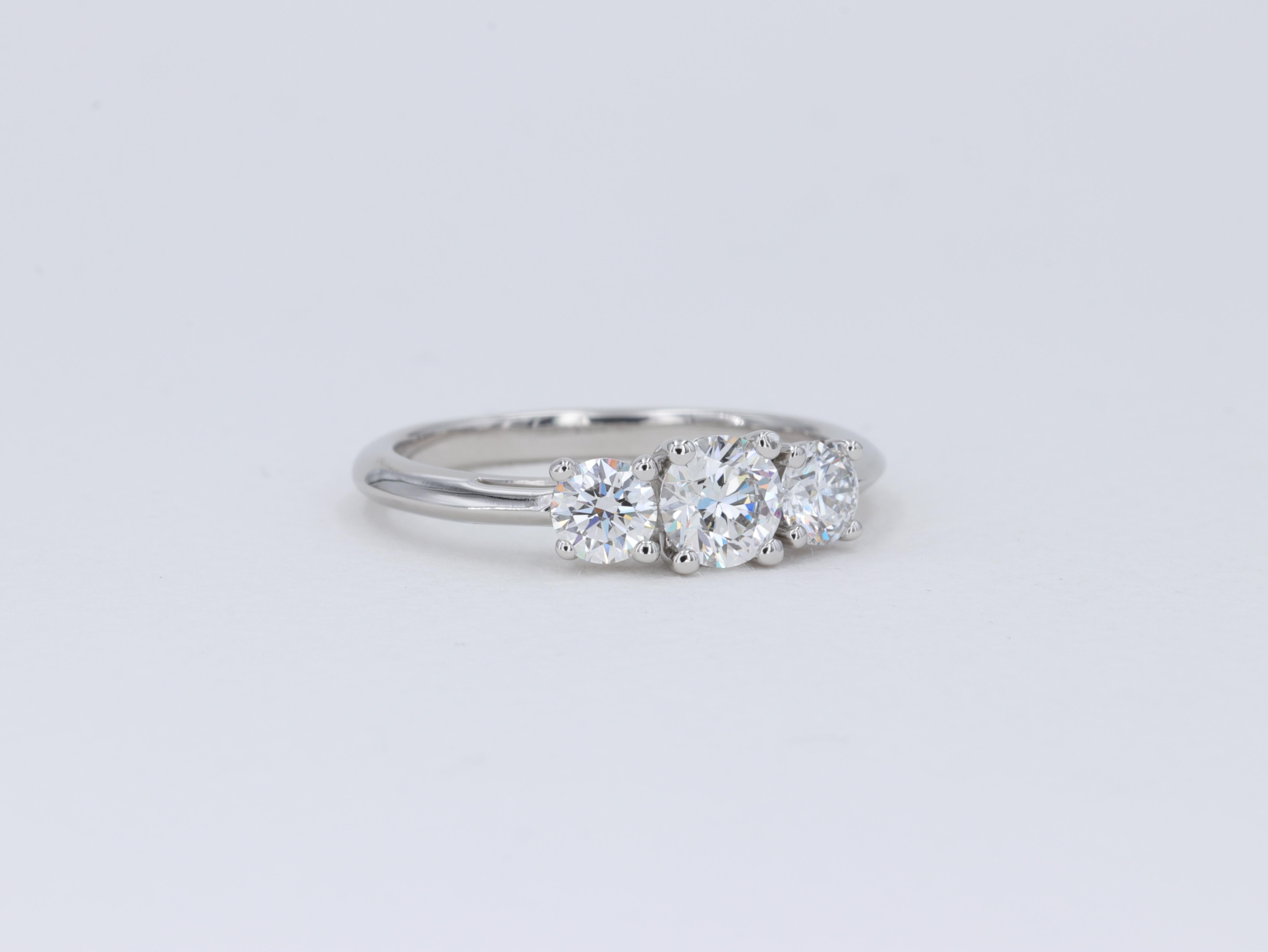 Modern Tiffany & Co. Three Stone Round Brilliant Cut Diamond Platinum Engagement Ring For Sale
