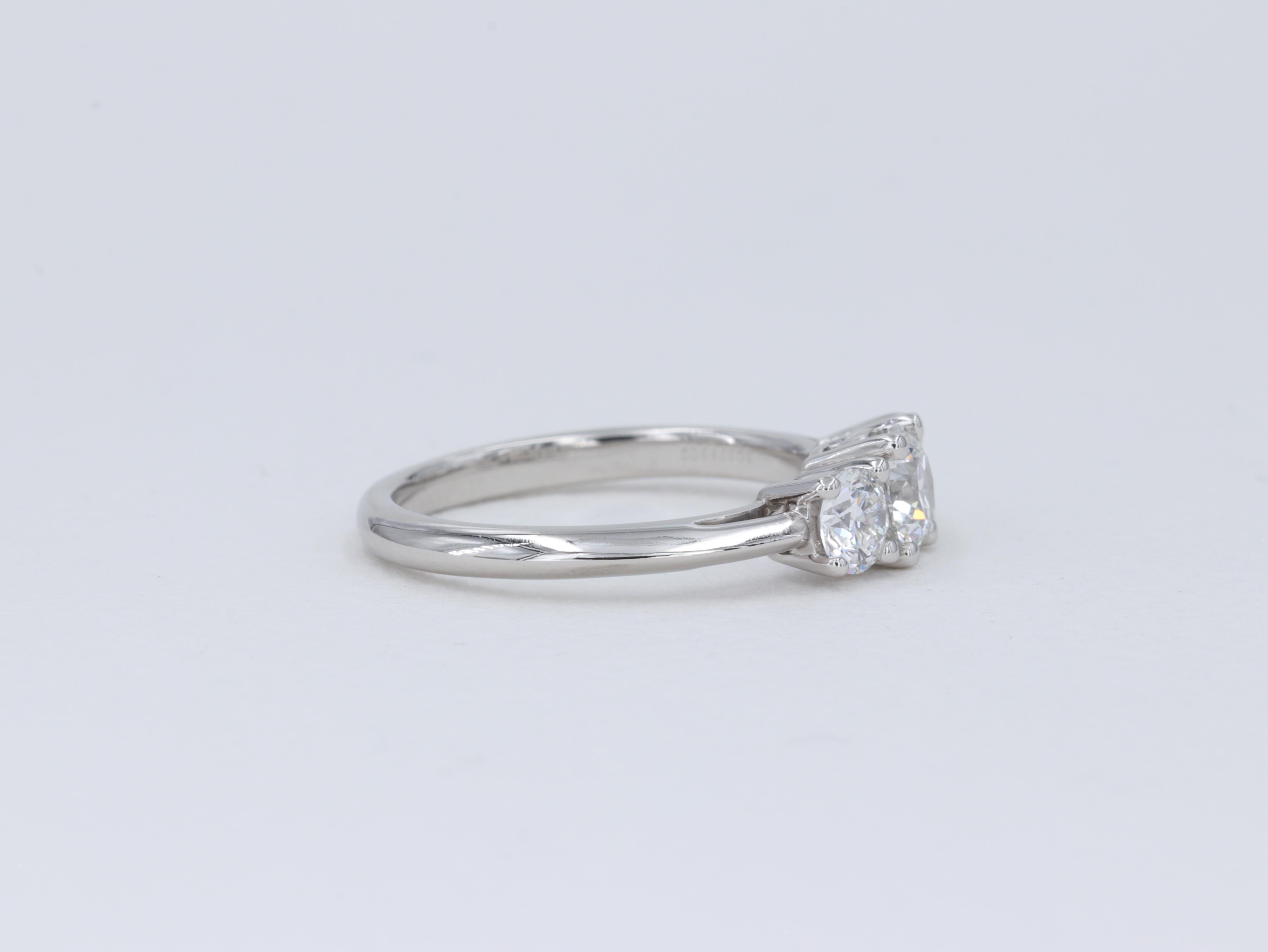 Tiffany & Co. Three Stone Round Brilliant Cut Diamond Platinum Engagement Ring In Excellent Condition For Sale In Tampa, FL