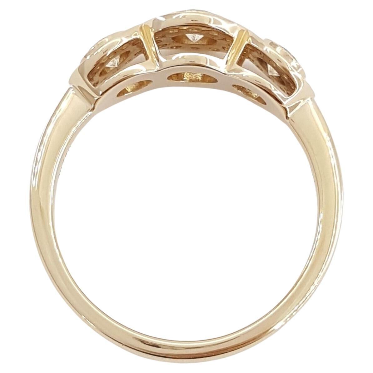 Tiffany & Co. Three-Stone Round Brilliant Diamond Halo Engagement Ring.

