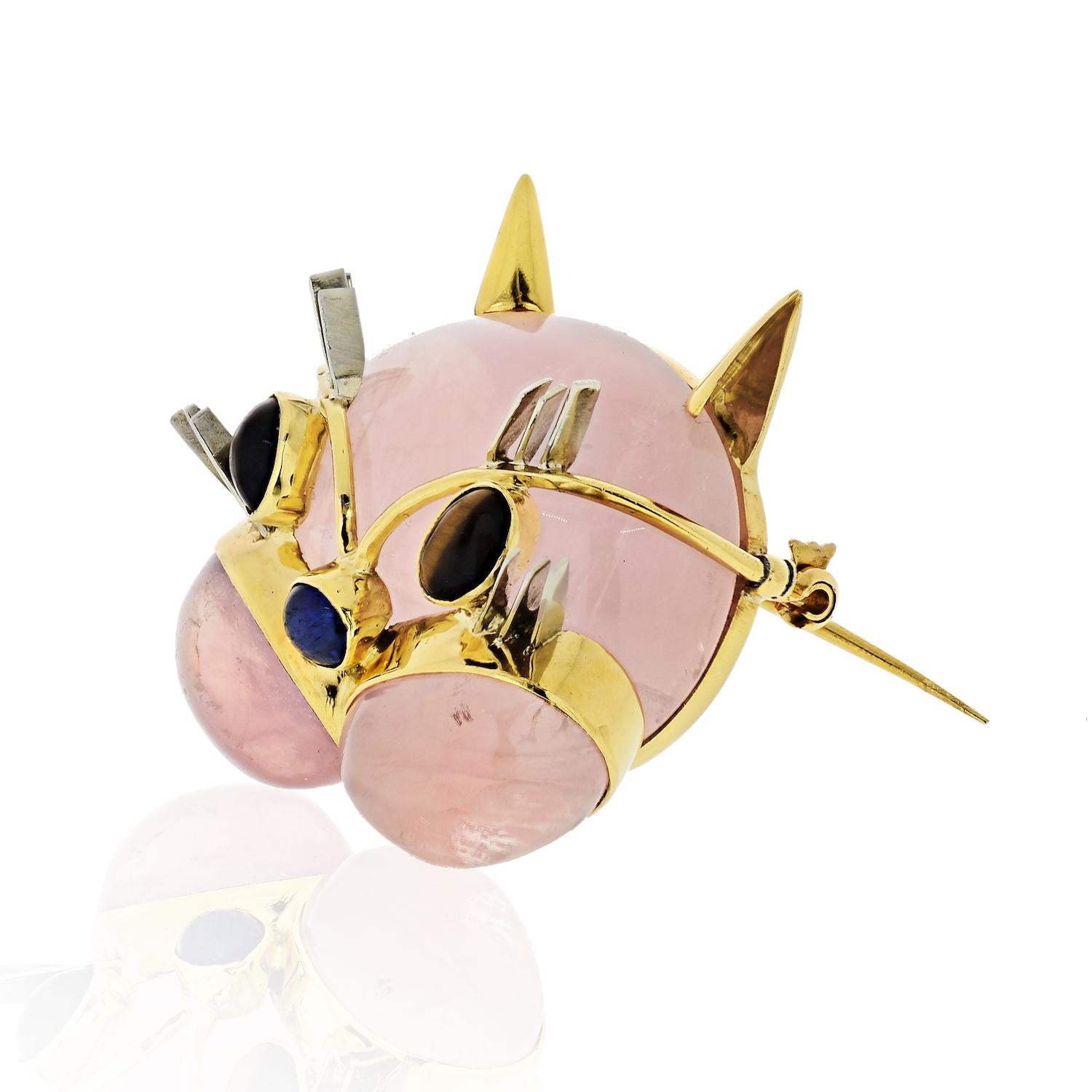 Excellent condition this lovely Cat brooch is made out of blush color rose quartz and is oh so cute. 
Sapphire nose and tiger eye color eyes. 

Crafted in 18K gold; set with oval cabochon rose quartz, measuring approximately 29.50 x 21.80 mm and