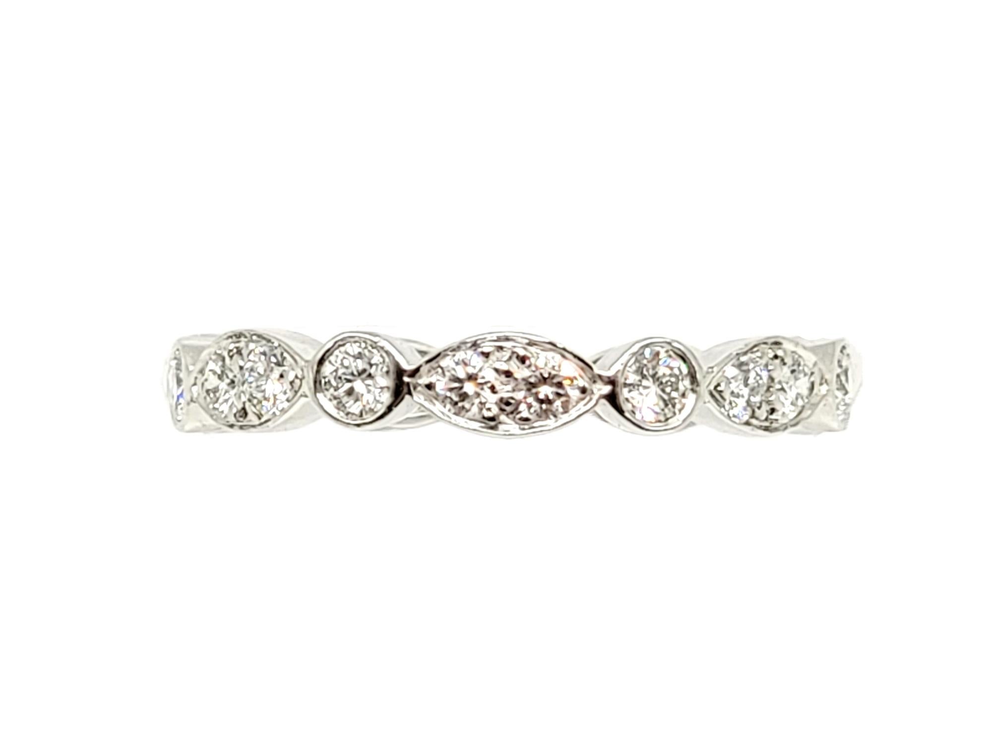 Ring size: 5.25

Exquisite Tiffany Jazz diamond and platinum band ring from renowned jeweler, Tiffany & Co.. This incredible ring has a vintage style charm with a modern, feminine twist.  It would be perfect paired with an engagement ring, or simply