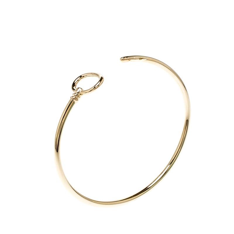 The Tiffany Keys have long been a symbol of a bright, prosperous future. This beautiful bracelet from Tiffany & Co. features their signature key design rendered in 18k rose gold into a narrow wire bracelet that wraps snugly around your wrist.