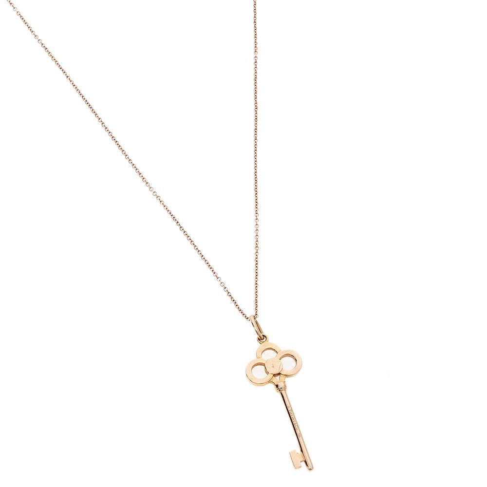 Tiffany & Co. carry the reputation of excellent craftsmanship and exquisite creativity when it comes to jewelry, and this gorgeous Key necklace in 18k yellow gold is a sweet proof. The pendant is shaped like a key and immaculately adorned with round