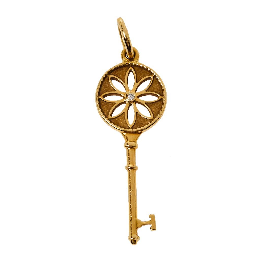 Radiating hope and optimism and symbolizing a bright future, the Tiffany keys from Tiffany & Co. are much loved and instantly recognizable. This pendant, featuring the iconic key, comes crafted from 18K yellow gold. It is detailed with a daisy motif