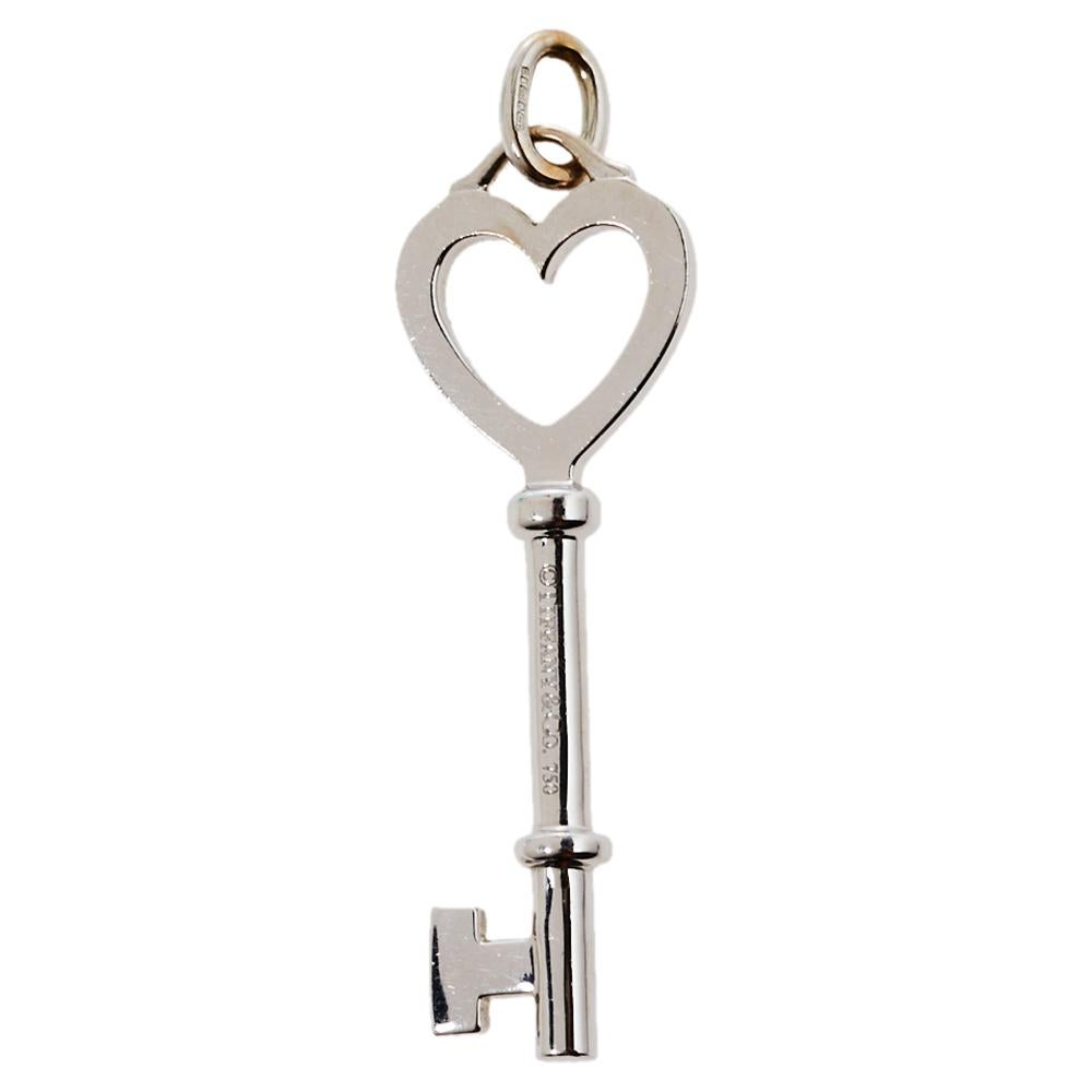 Radiating hope and optimism and symbolizing a bright future, the Tiffany keys from Tiffany & Co. are much loved and instantly recognizable. This pendant, featuring the iconic key, comes crafted from 18K white gold. It is detailed with a cut-out