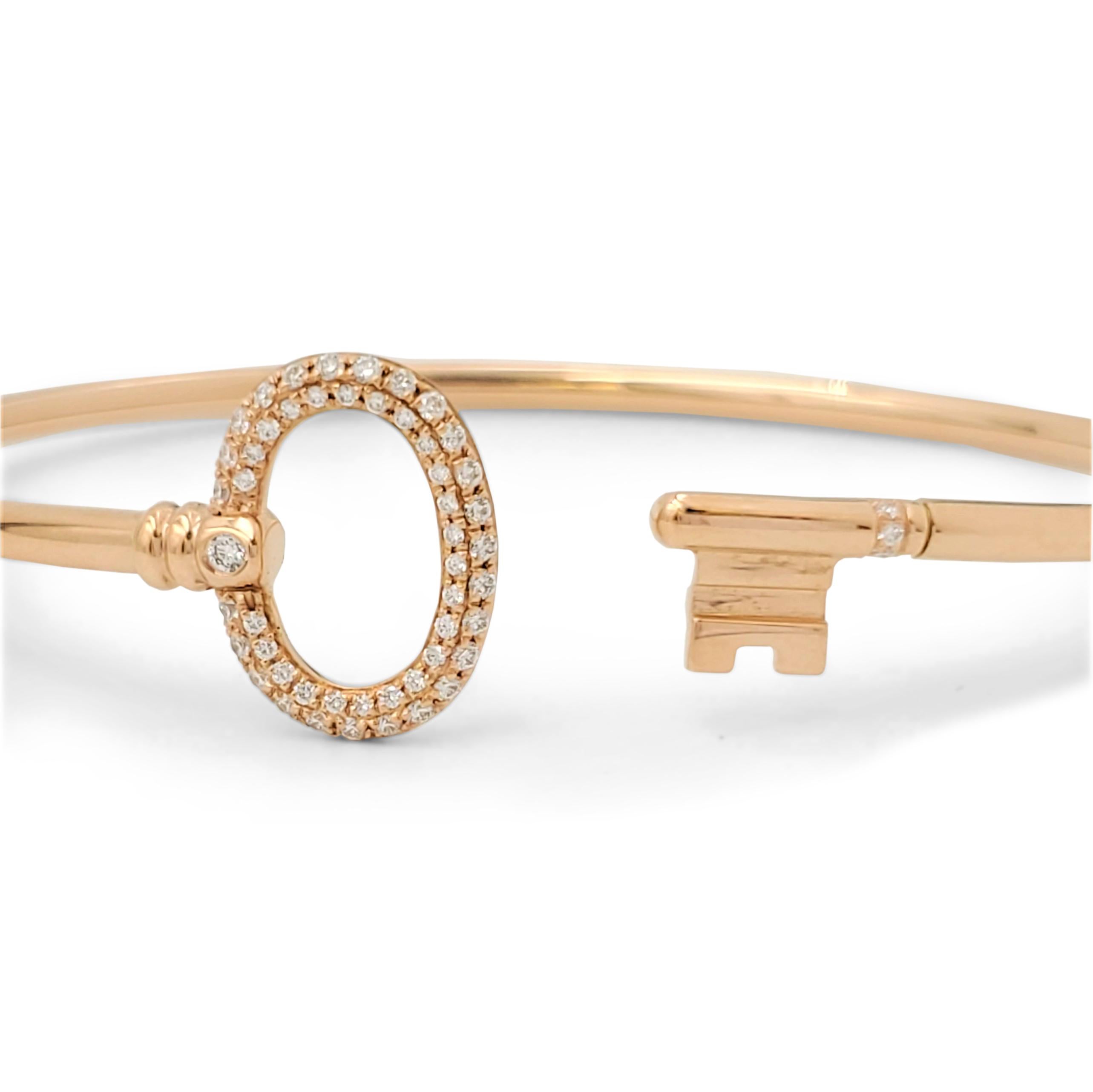Authentic Tiffany & Co. bracelet from the 'Tiffany Keys' collection crafted in 18 karat rose gold. Pavé set round brilliant cut diamonds weighing an estimated 0.25 carats trace the elegant design. Signed T&Co., Au750, Italy. The bracelet is not