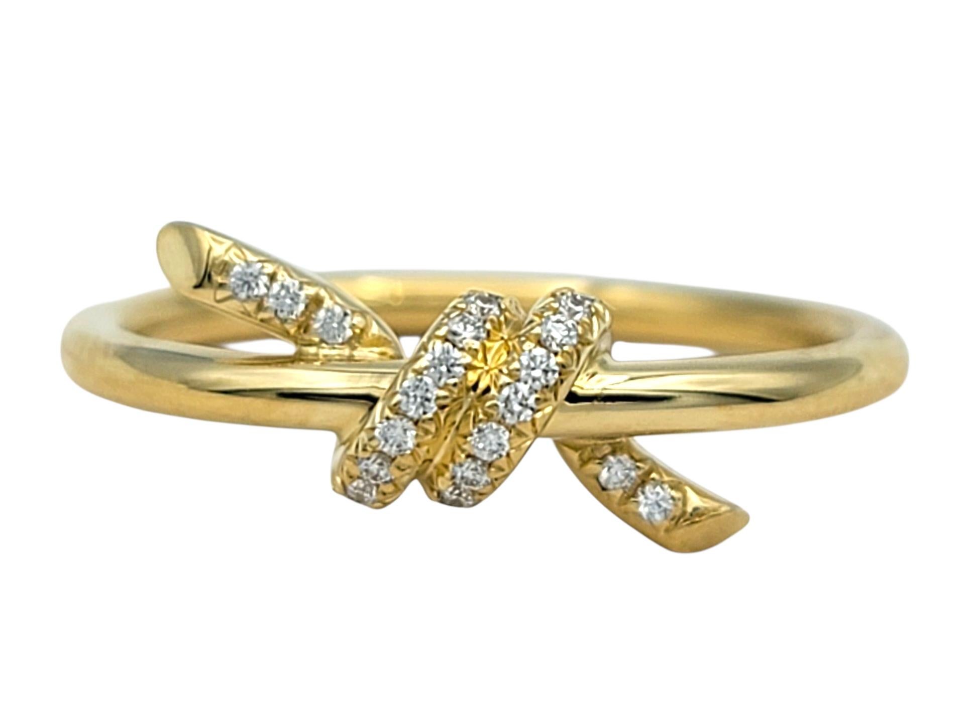 Ring Size: 6

This elegant Tiffany & Co. ring is crafted in radiant 18 karat yellow gold and features the iconic Tiffany Knot design. The slim, polished band wraps around itself in a sculptural loop that creates a graceful, symbolic gesture of