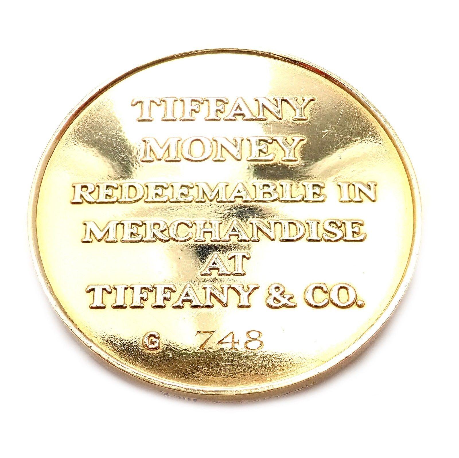 18k Solid Yellow Gold Vintage $1000 Tiffany Money Coin by Tiffany & Co.
Details:
Dimensions: coin measures 1 ¼ inches in diameter and 1/8 inch in depth
Weight: 32.1 grams
Stamped Hallmarks: Hallmarks:
One Thousand Dollars T&CO
TIFFANY MONEY