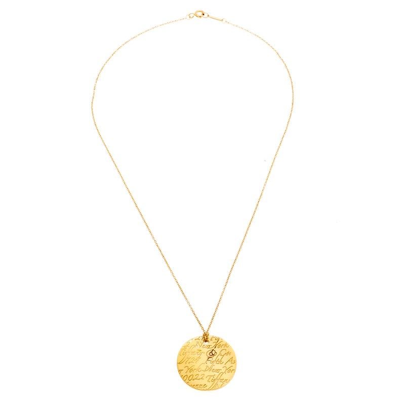 Wonderfully made from 18k yellow gold, this elegant necklace by Tiffany & Co. is from the Tiffany Notes collection. It features a chain with a spring ring clasp and a round pendant with brand inscriptions. Through its simple appeal and smooth