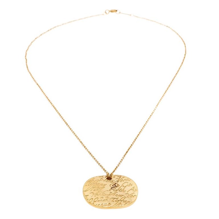 Tiffany and Co. Tiffany Notes Engraved 18k Yellow Gold Round Wave