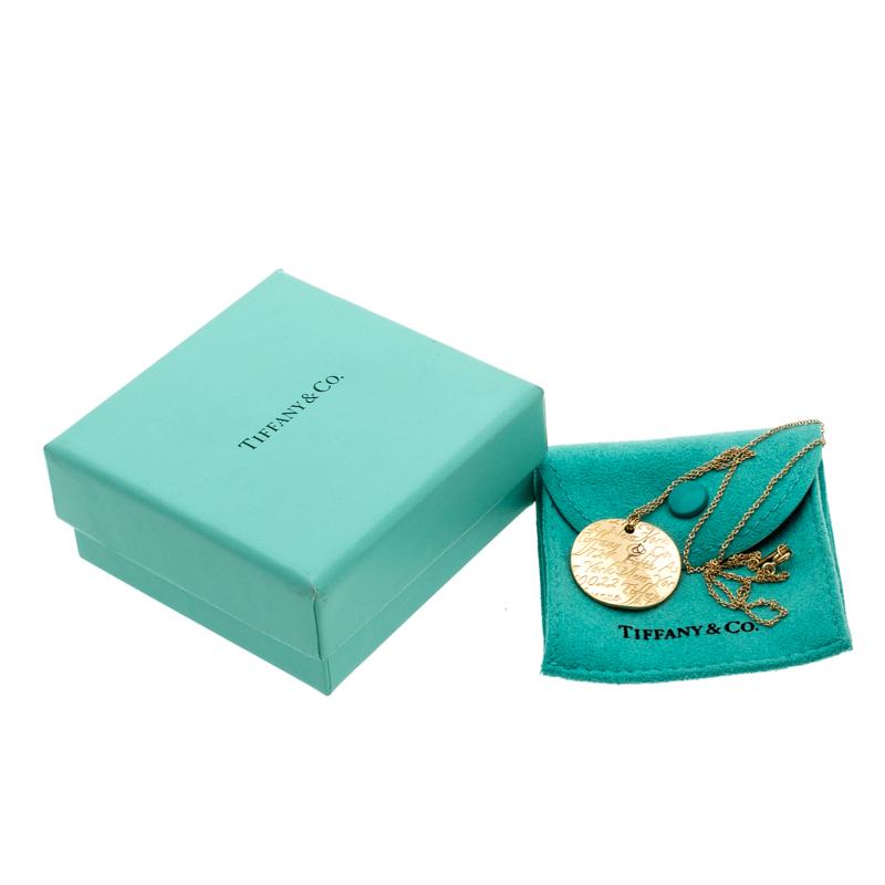 Contemporary Tiffany & Co. Tiffany Notes Engraved 18k Yellow Gold Round Wave Pendant Necklace