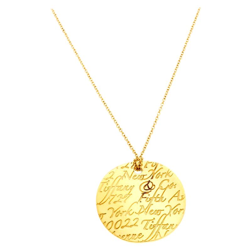Tiffany & Co. Tiffany Notes Engraved 18k Yellow Gold Round Wave Pendant Necklace