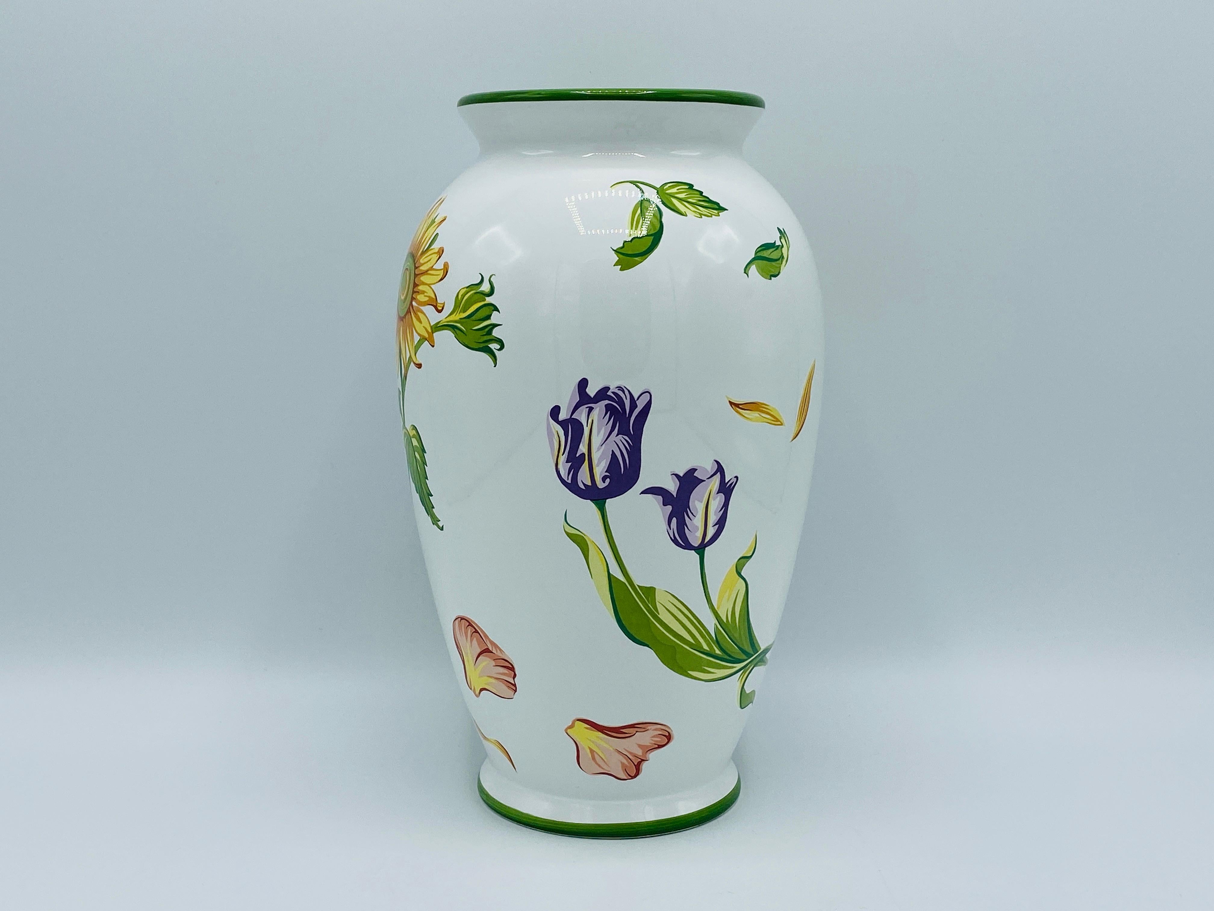 Listed is a collectible, Tiffany & Co. ceramic 'Tiffany Petals' vase, circa 1998. Hand painted with sunflower, rose petal, and tulip motifs. Made in Portugal. Marked on underside. Heavy, weighing 2.6lbs.