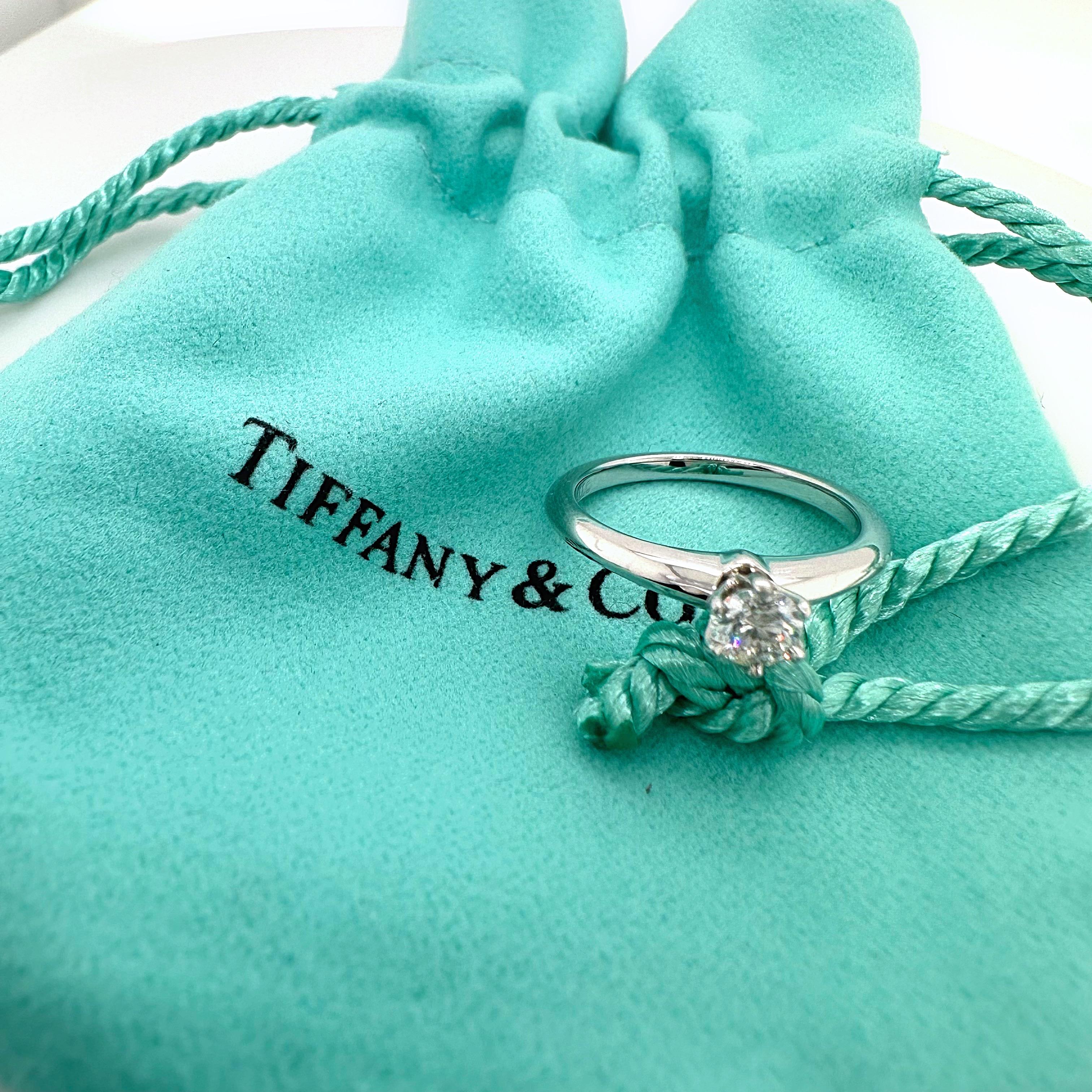 Tiffany & Co. Tiffany Setting Round Diamond Engagement Ring
Style:  Solitaire
Ref. number:  17069438
Metal:  Platinum
Size:  4.5 sizable
Measurements:  2 mm
Main Diamond:  0.19 cts
Color & Clarity:  F, VS2
Hallmark:  ©TIFFANY&CO. PT950 17069438 .19