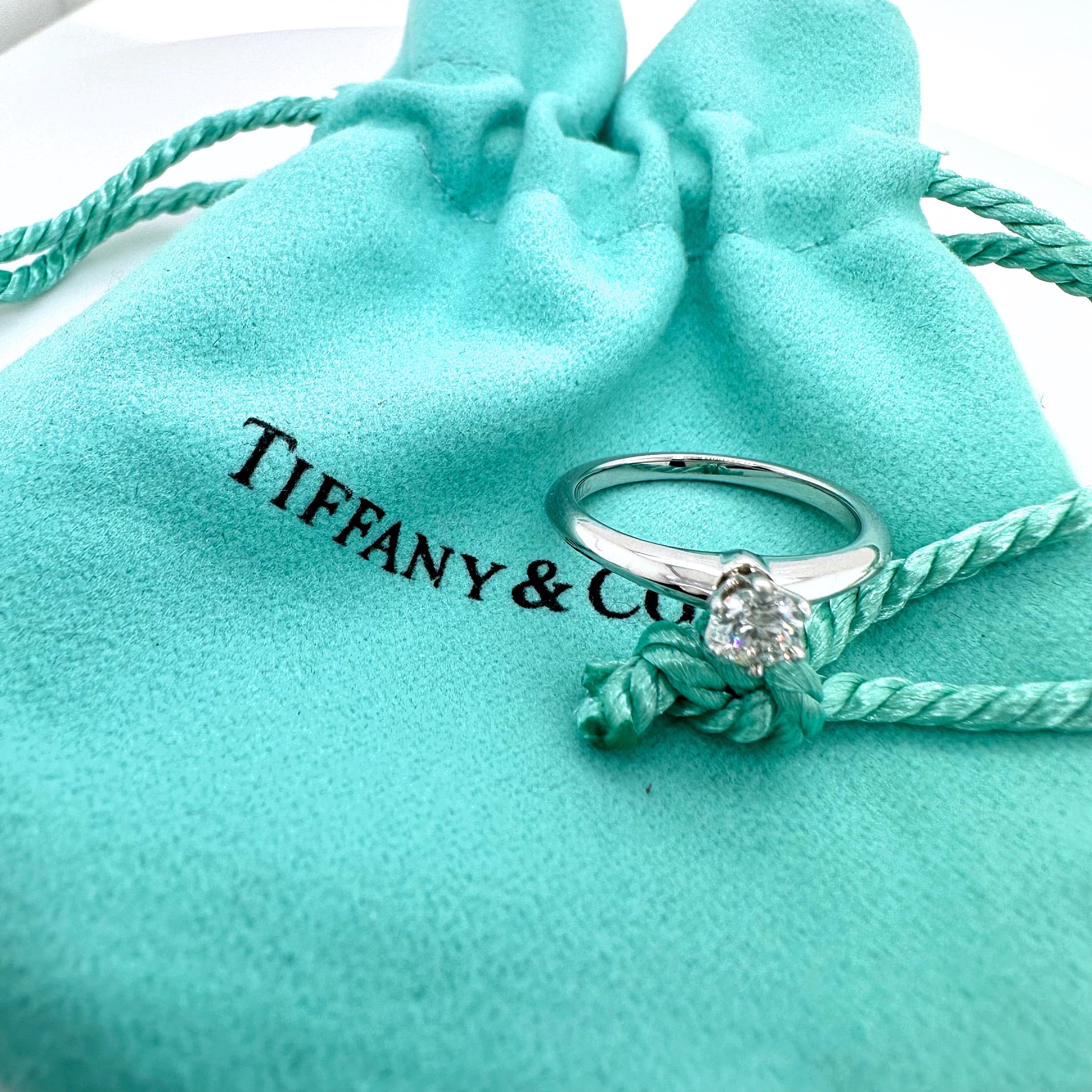Tiffany & Co. Tiffany Setting Round Diamond Engagement Ring
Style:  Solitaire
Ref. number:  32274811
Metal:  Platinum
Size:  4.5 sizable
Measurements:  2 mm
Main Diamond:  0.20 cts
Color & Clarity:  G, VS1
Hallmark:  ©TIFFANY&CO. PT950 32274811 D.20