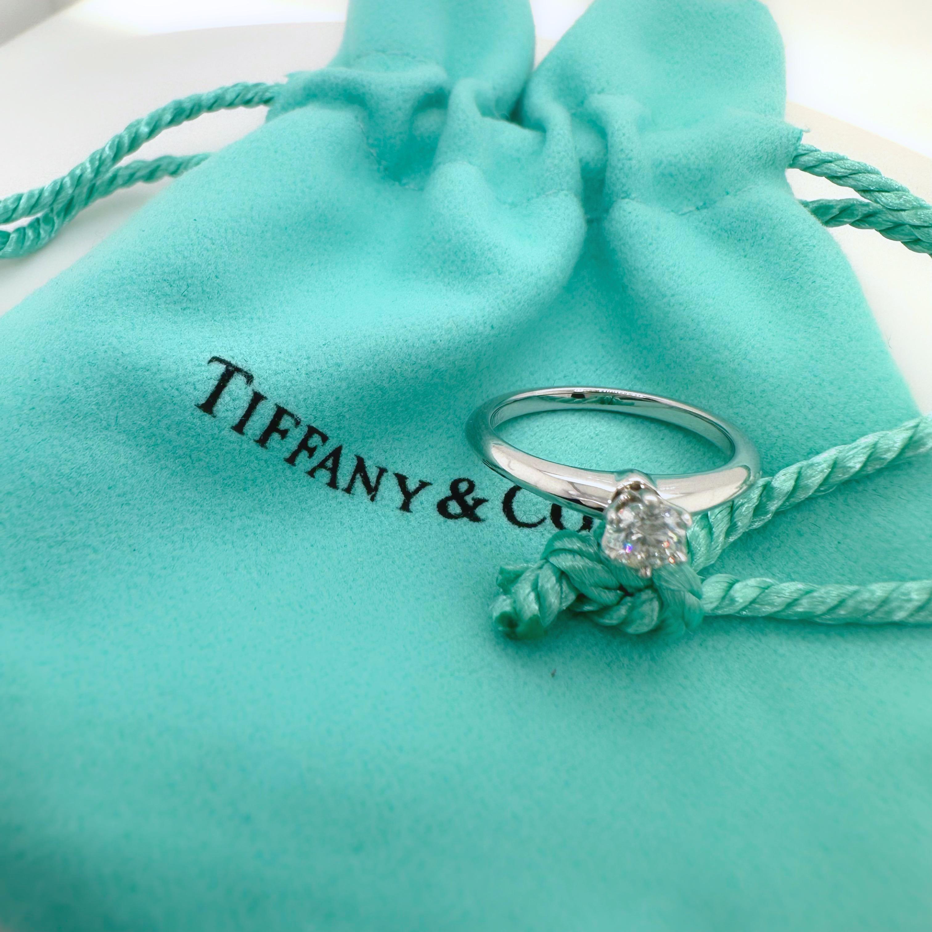 Tiffany & Co. Tiffany Setting Round Diamond Engagement Ring
Style:  Solitaire
Ref. number:  T89554
Metal:  Platinum
Size:  3.5 sizable
Measurements:  2 mm
Main Diamond:  0.21 cts
Color & Clarity:  E, VS1
Hallmark:  ©TIFFANY&CO. PT950 T89554