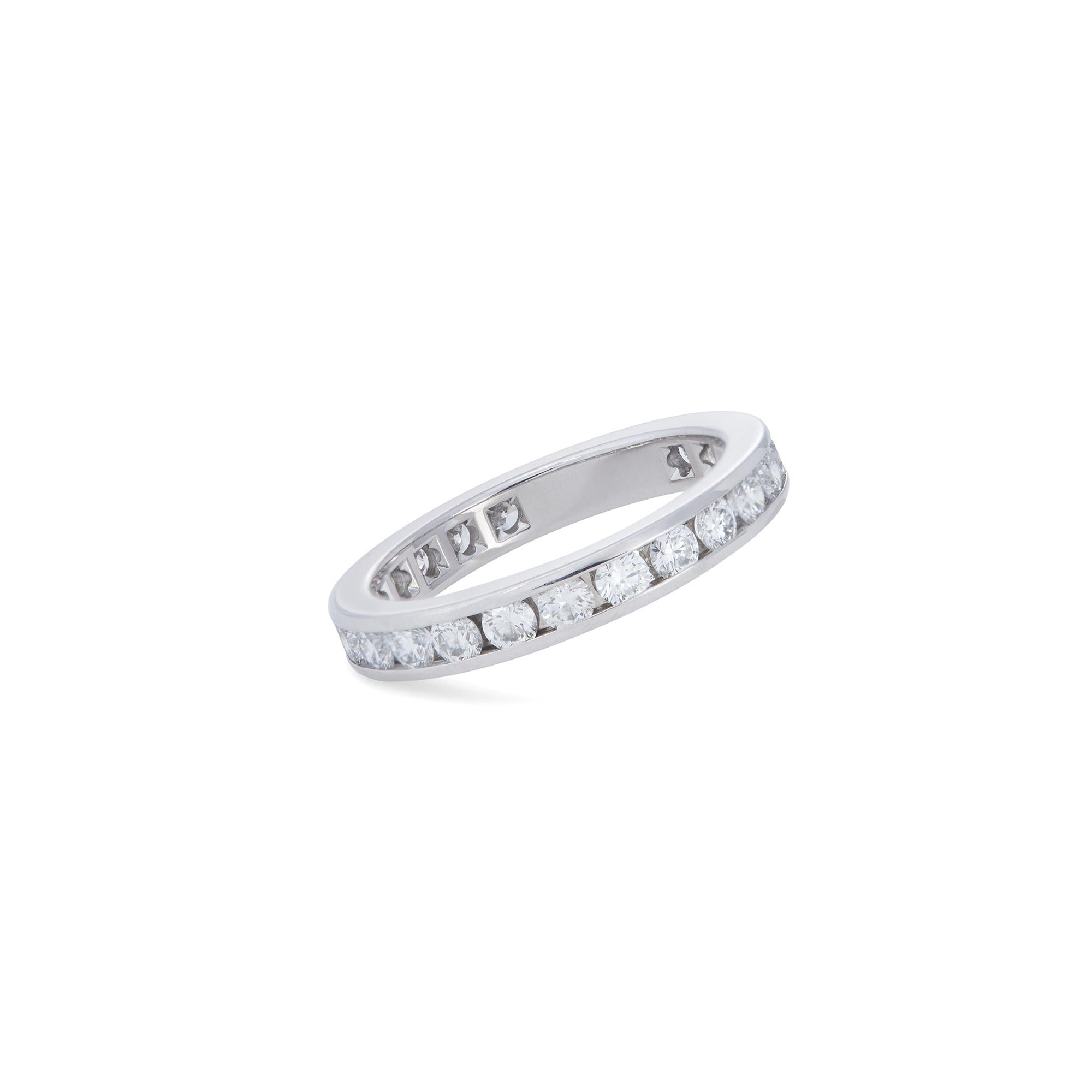 Authentic Tiffany & Co. Tiffany Setting wedding band crafted in platinum.  The channel set eternity band features 24 gorgeous round brilliant cut diamonds of an estimated 0.85 carats total weight and measures 3mm in width.  Size 4 1/2.  Signed