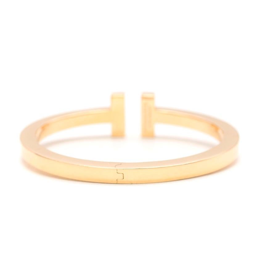 Tiffany & Co 18k Gold Square Bracelet 

This bold bracelet exudes sophistication. As multifaceted as it is iconic, the Tiffany T collection is a tangible reminder of the connections we feel but can't always see. Wear this sleek design in a